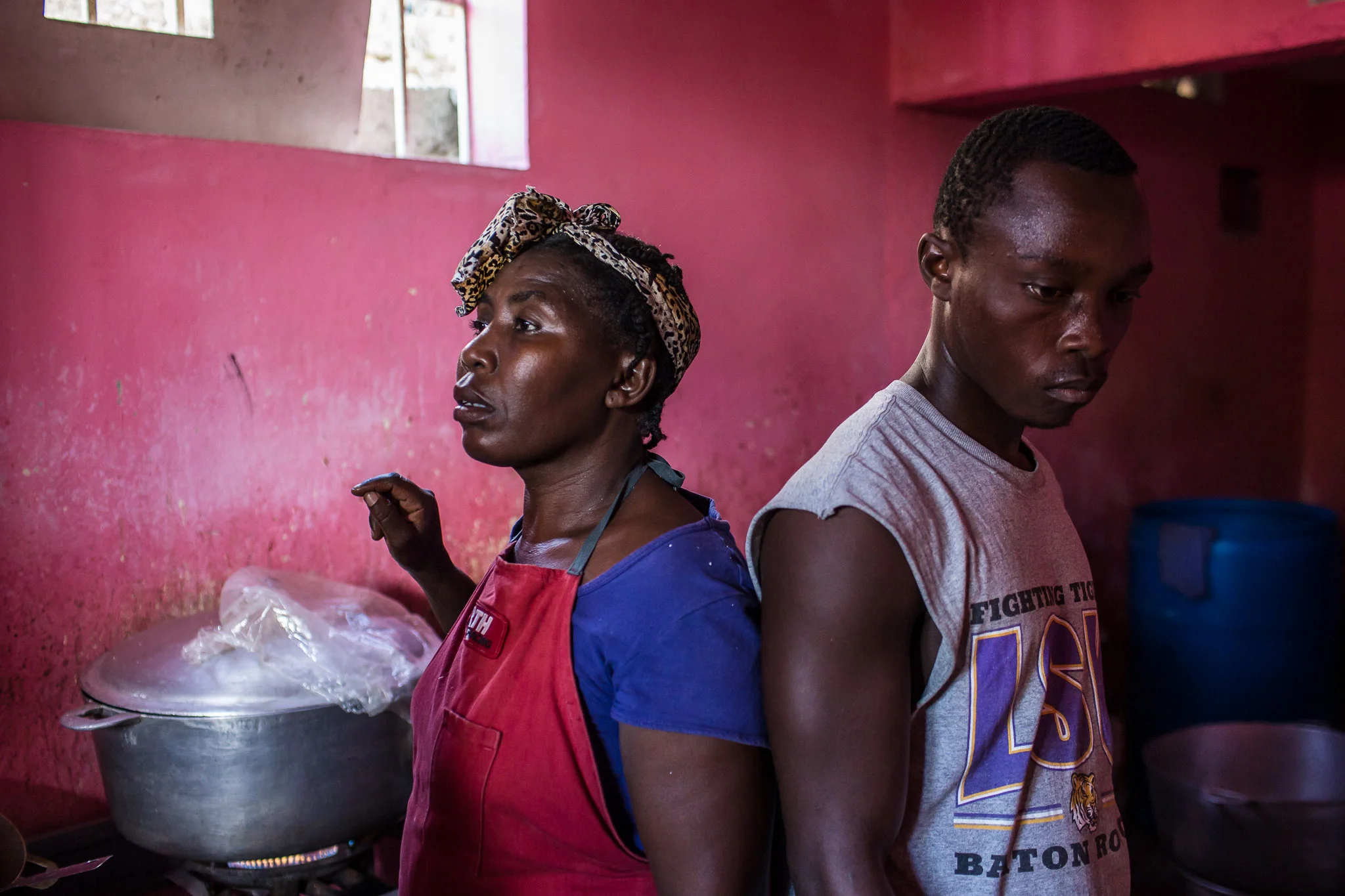 Kitchen workers at a restaurant in the Tapis Rouge neighborhood on Monday, December 22, 2014 in Port-au-Prince, Haiti. The restaurant was initially funded as a government program, and is required to serve meals that cost the equivalent of less than 25 cents US, which both provides cheap food for residents and a local business for entrepreneurs.