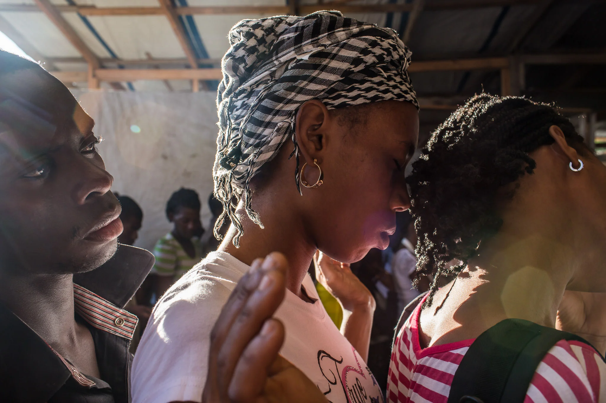 Worshipers at L'Eglise Evangelique Piscine de Bethesda, the church of televangelist Marcorel Zidor, on Saturday, December 20, 2014 in Port-au-Prince, Haiti. Pastor Zidor attracts a large audience with his emotional services and miracle medical cures of dubious theraputic value.
