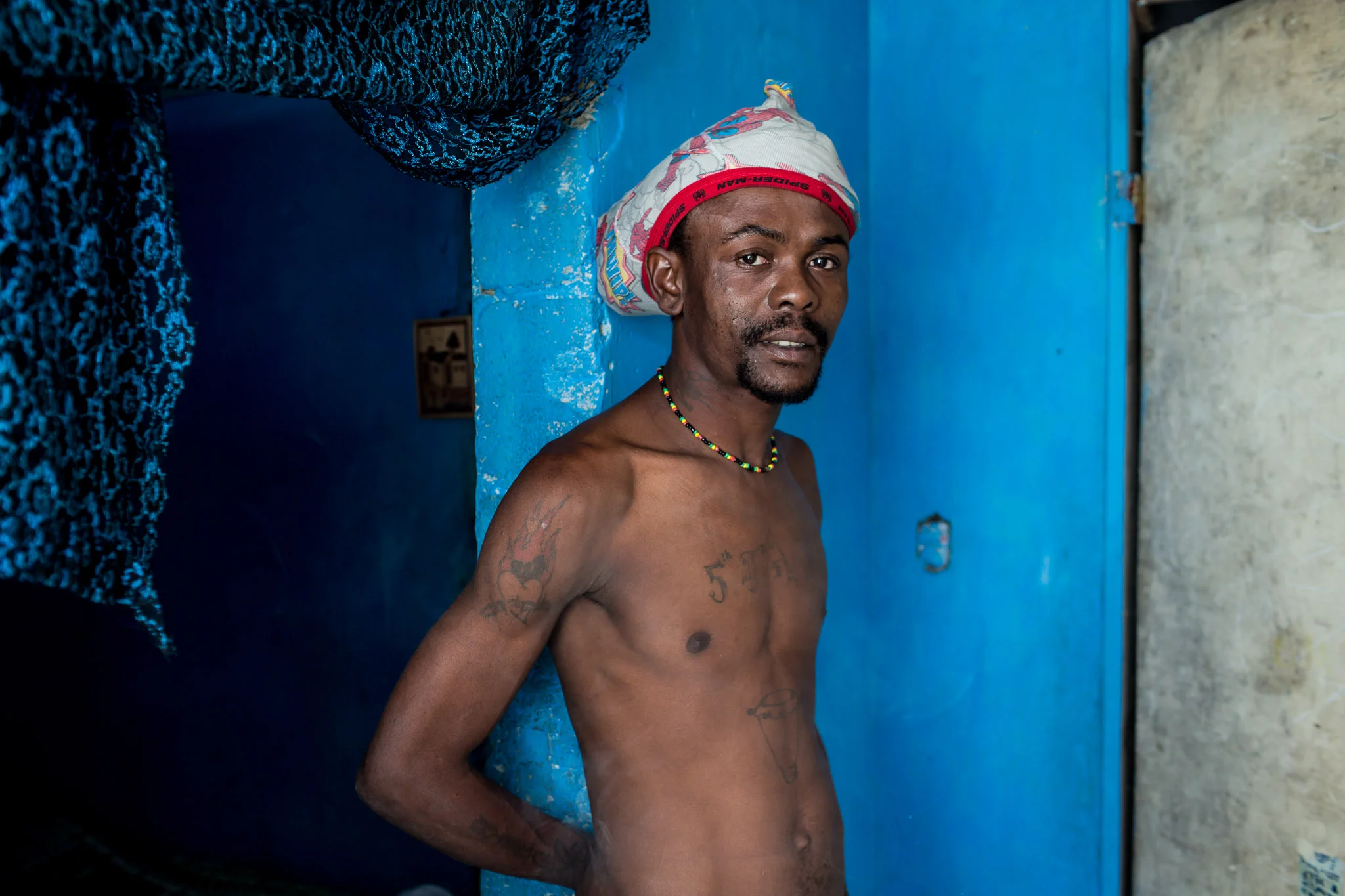 Emmanuel Deus, a musician, poses for a portrait at his home on Thursday, December 18, 2014 in Port-au-Prince, Haiti. Fort National was among the hardest hit areas of Port-au-Prince in the 2010 earthquake, but rebuilding has been slow to non-existent. Residents still mostly lack electricity and running water.