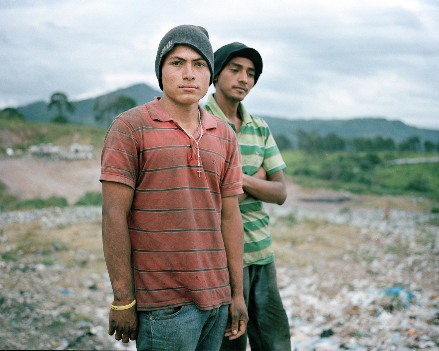  Angel and Gerson pose for a portrait in the municipal dump where they work in Tegucigalpa. 