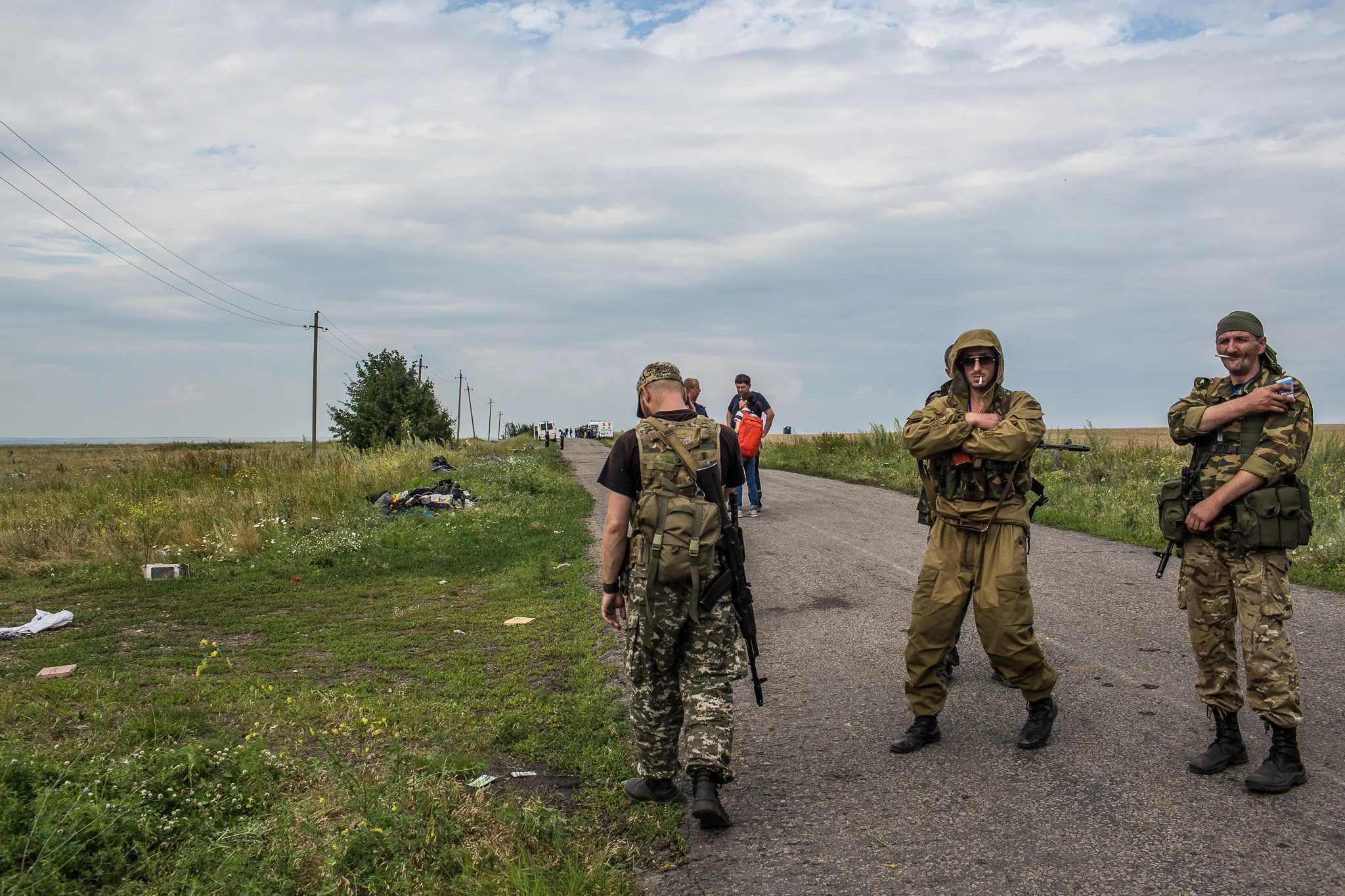 Pro-Russia rebels guard the site of the crash of Malaysia Airlines flight MH17 on July 19, 2014 in Grabovo, Ukraine. Malaysia Airlines flight MH17 was travelling from Amsterdam to Kuala Lumpur when it crashed killing all 298 on board including 80 children. The aircraft was allegedly shot down by a missile and investigations continue over the perpetrators of the attack.