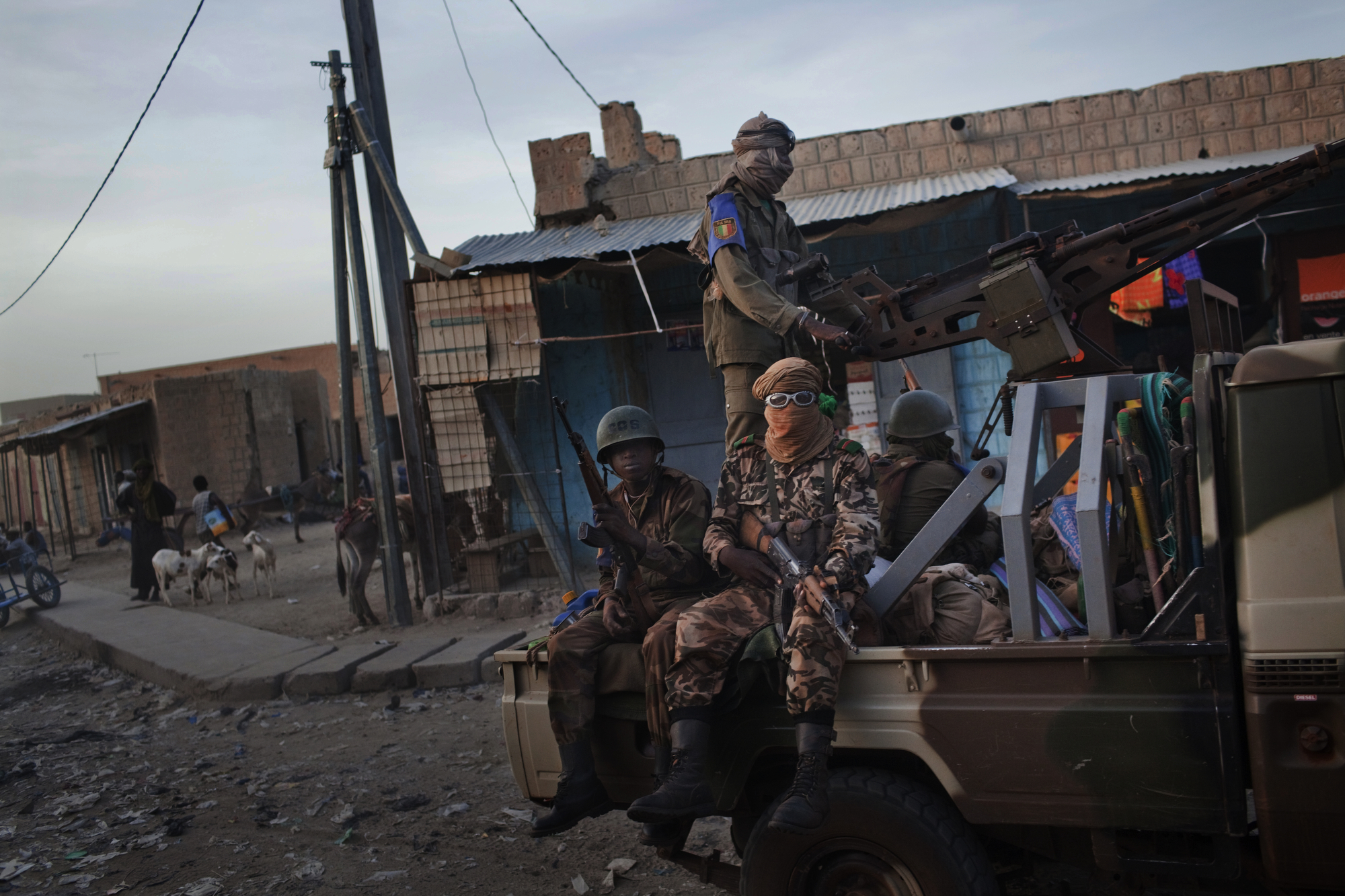  TIMBUKTU, Mali. OCTOBER 2013. A Malian military convoy makes it way through downtown Timbuktu, Mali. Mali, a predominantly Muslim country, has been known for it�s vibrant culture, rich ancient Islamic history, religious tolerance and joyful music an