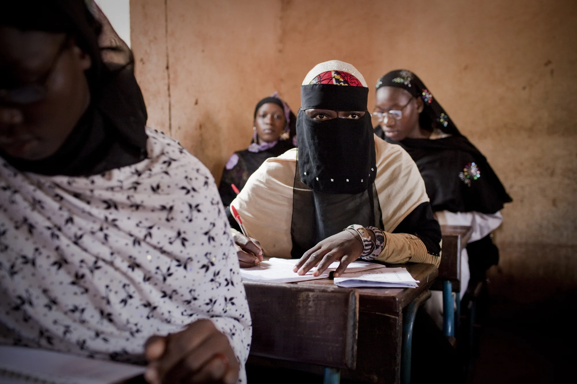 Bamako, Mali. OCTOBER 2013. A co-ed Islamic school in Bamako, Mali. Mali, a predominantly Muslim country, has been known for it�s vibrant culture, rich ancient Islamic history, religious tolerance and joyful music and dance. Yet much of this culture was at risk of permanent destruction last year when militant Islamist rebels took over Northern Mali from 2011-2012. The rebels imposed their own despotic version of religious Islamic law and women bore the brunt of the crackdown. Many women fled, while some remained in the confines of their homes for over a year. In the spring of 2013 the French army entered Mali and defeated the Islamist militias. (Photo by Katie Orlinsky/Getty Images)