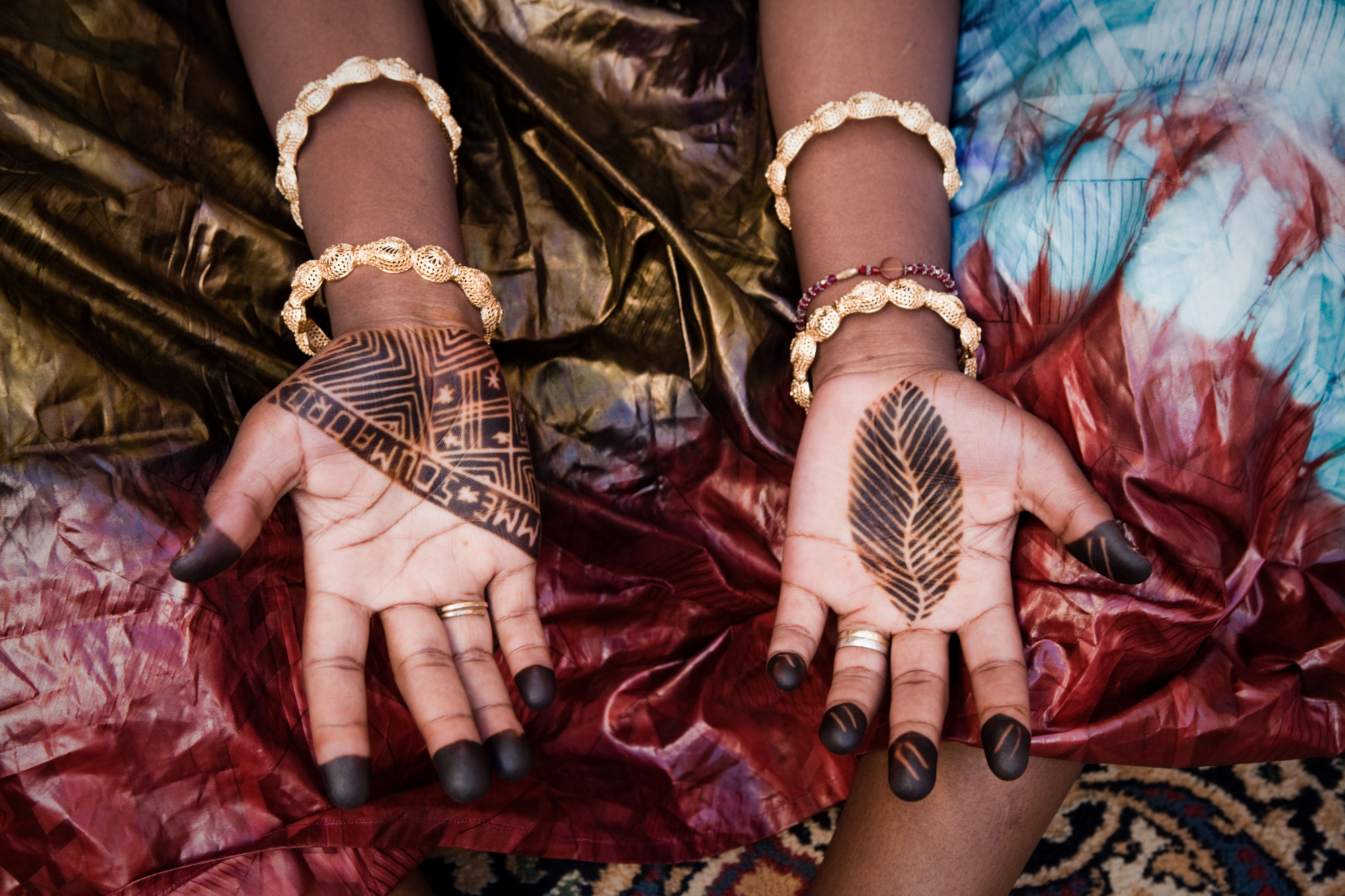  Bamako, Mali. SEPTEMBER 2013. A mother gets henna done for a baby naming ceremony in Bamako, Mali. Mali, a predominantly Muslim country, has been known for it�s vibrant culture, rich ancient Islamic history, religious tolerance and joyful music and 