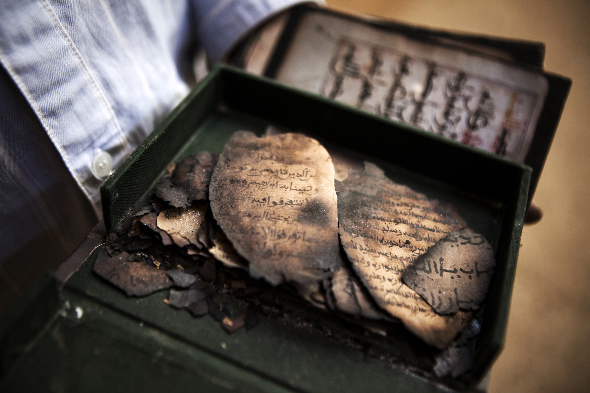  TIMBUKTU, Mali. OCTOBER 2013. The remains of destroyed manuscripts at the Ahmed Baba Institute of Higher Learning and Islamic Research in Timbuktu, Mali. The institute was home to thousands of manuscripts that were destroyed by Jihadists, who used i