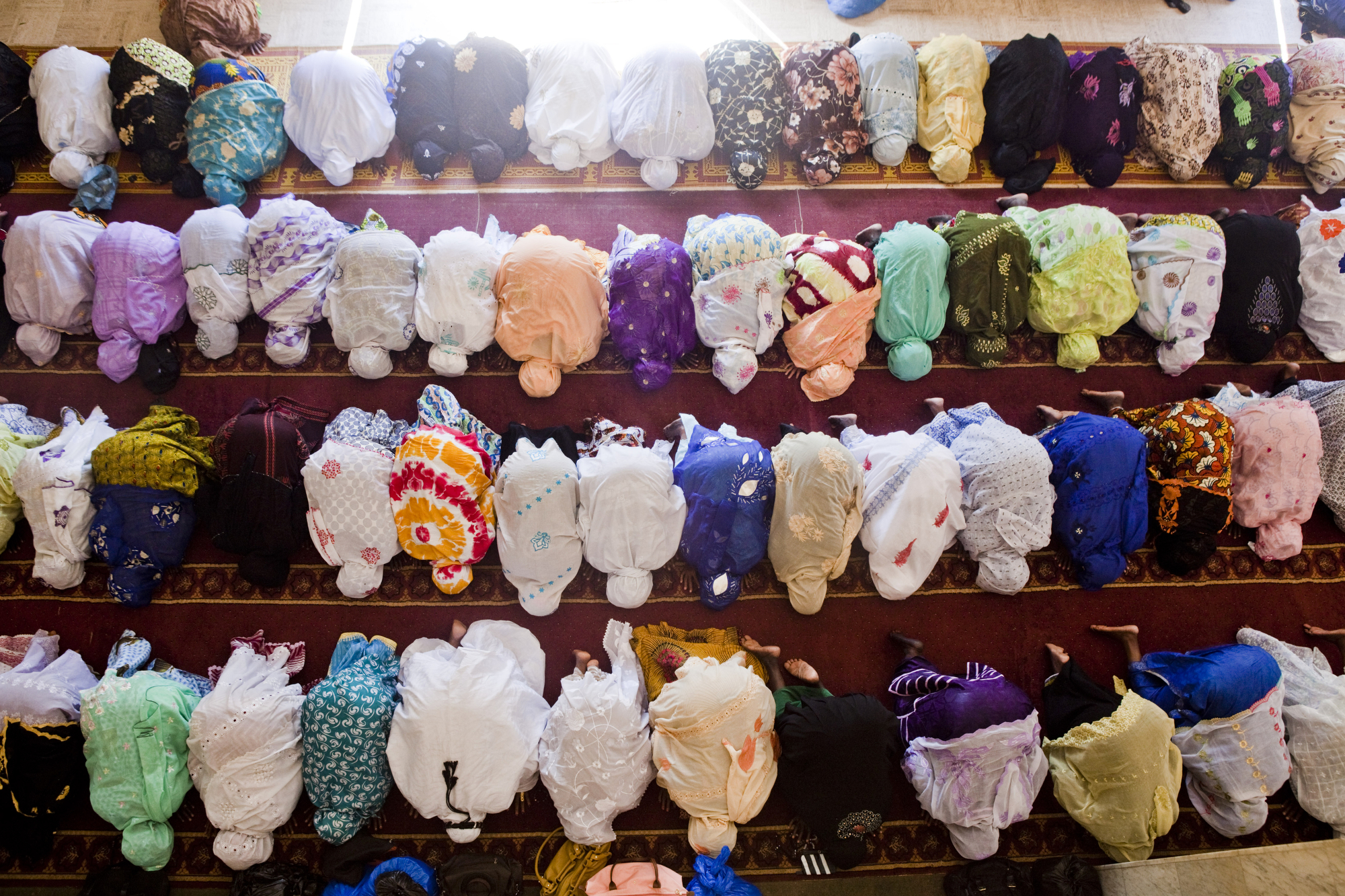  Bamako, Mali. OCTOBER 2013. The women's section of Friday prayers at the Grand Mosque in Bamako, Mali. 

Summary: Mali, a predominantly Muslim country, has been known for it�s vibrant culture, rich ancient Islamic history, religious tolerance and jo