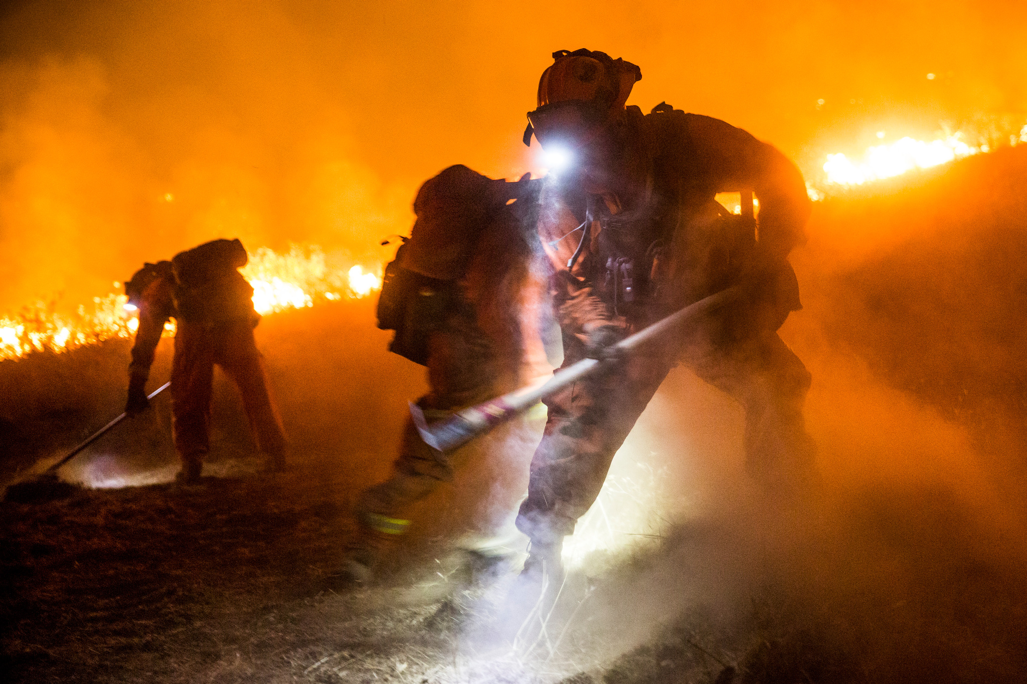  Antelope convict firefighters dig a fire line as the Butte Fire approaches near San Andreas, California, September 12, 2015. 