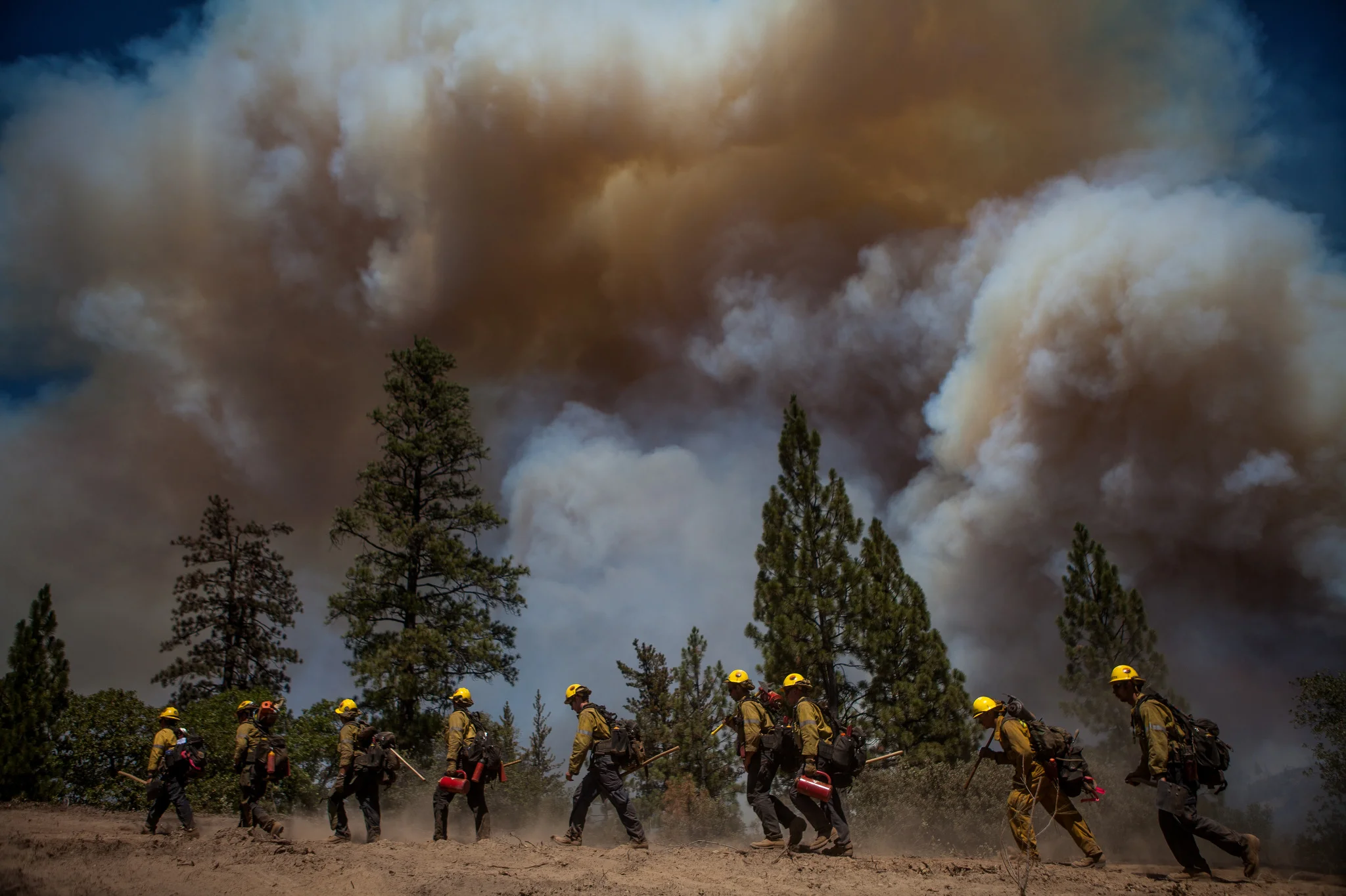 Los Angeles County firefighters hike in on a fire line on the Rim Fire near Groveland, California, August 22, 2013. The Rim Fire burned 257,314 acres and is the third largest wildfire in California history.