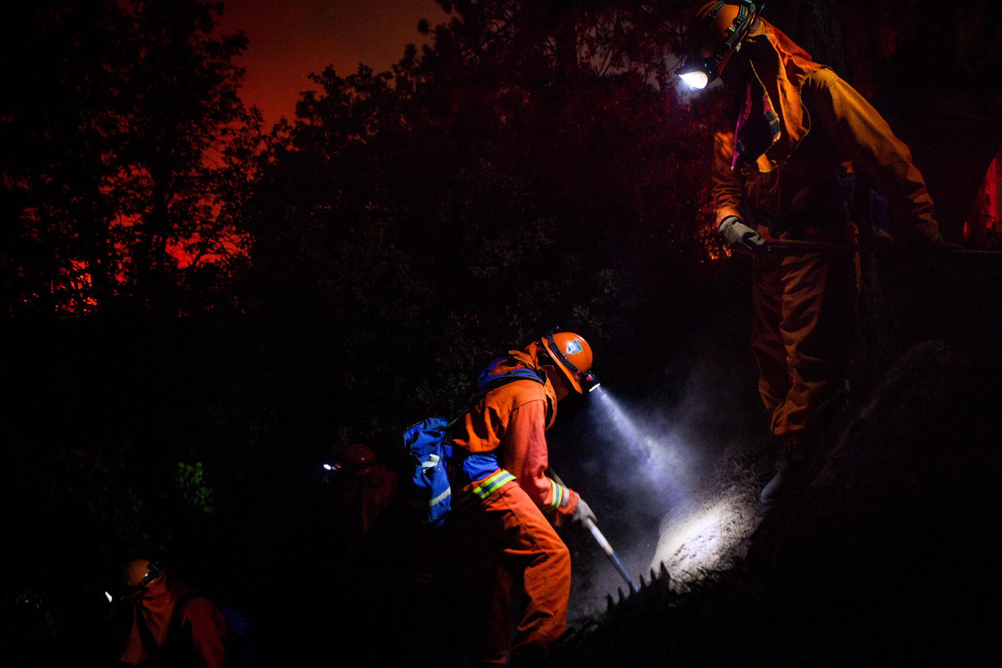  The McCain inmate crew struggles to cut a fire line on a steep slope on the Rim Fire near Buck Meadows, California, August 24, 2013. The Rim Fire burned 257,314 acres and is the third largest wildfire in California history. 