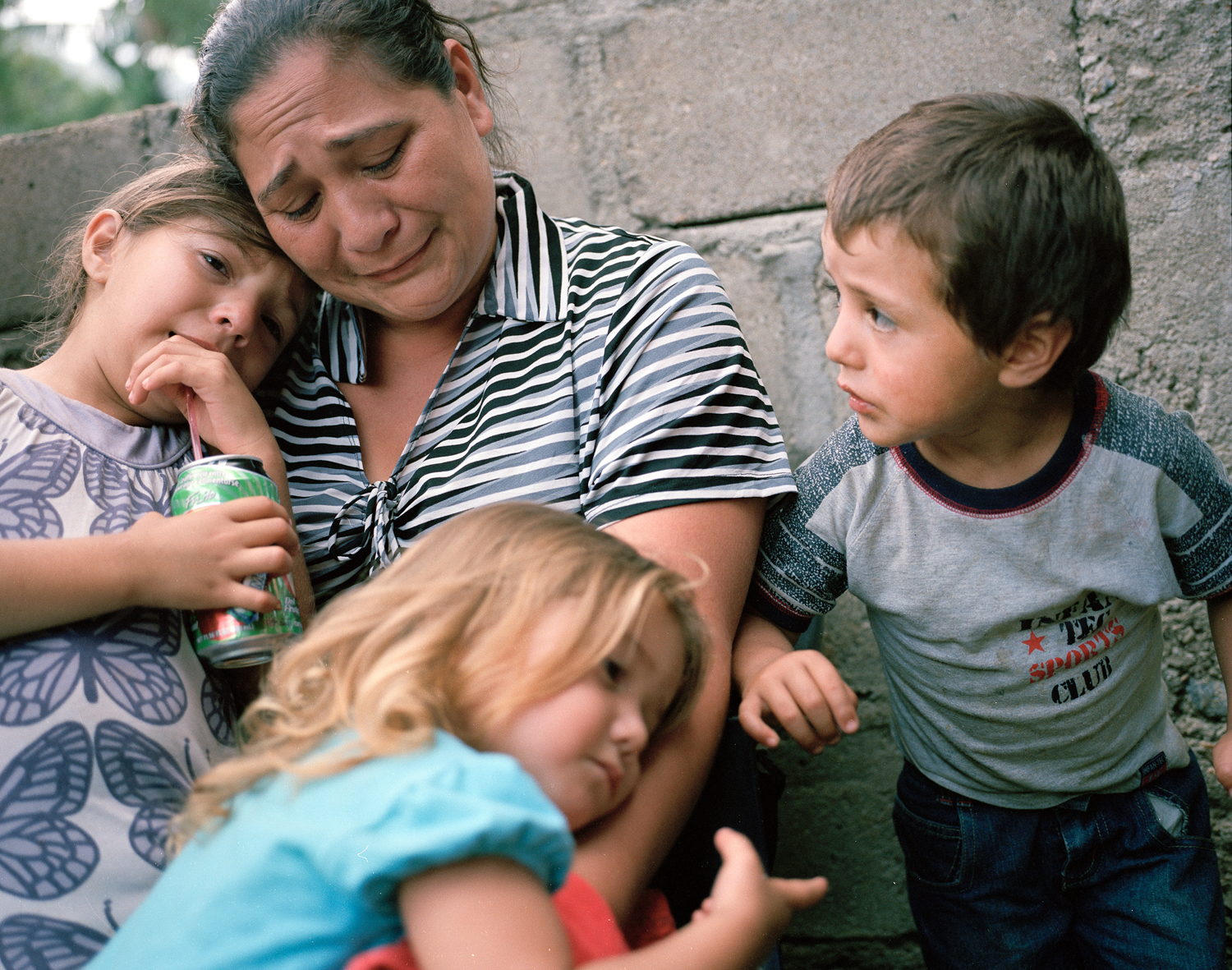  Lizeth Cerros mourns her murdered husband, Darwin Franco, with her children, later she received another death threat. Franco was a community organizer. 