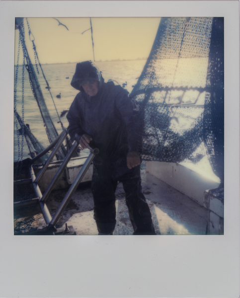 Deckhand Arthur Miller sets nets off the coast of Galveston, Texas while shrimping for bait on the "Sherry Diane." (Dominic Bracco II / Prime for WWF Magazine) 