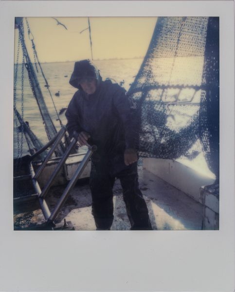 Deckhand Arthur Miller sets nets off the coast of Galveston, Texas while shrimping for bait on the "Sherry Diane." (Dominic Bracco II / Prime for WWF Magazine)