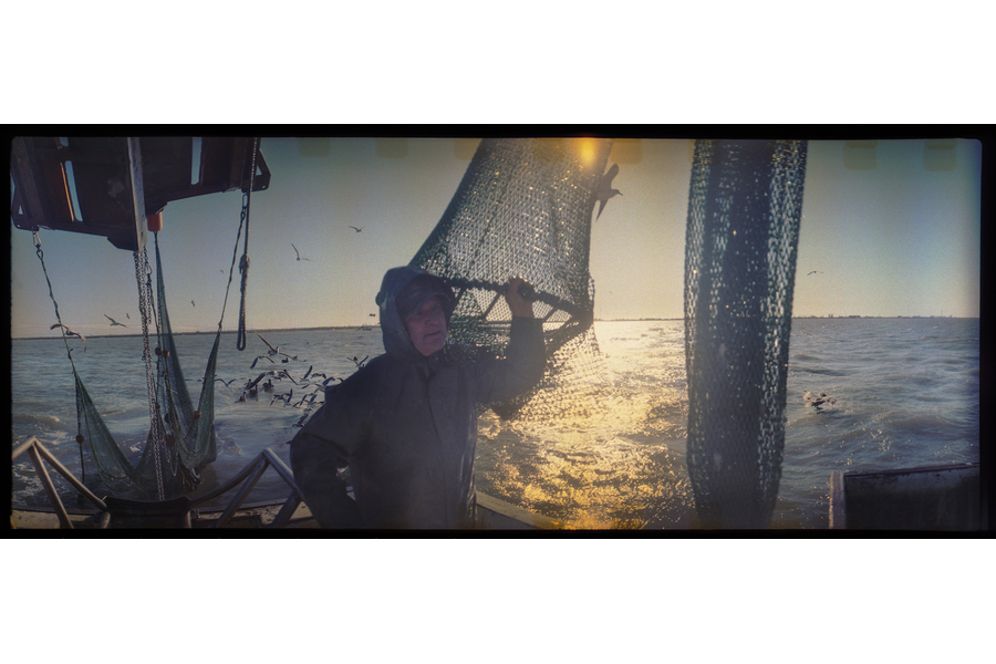  Deckhand Arthur Miller sets nets off the coast of Galveston, Texas while shrimping for bait on the "Sherry Diane." (Dominic Bracco II / Prime for WWF Magazine) 