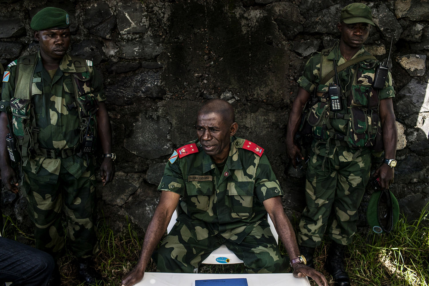  General Bahuma Ambamba, the commanding officer of all FARDC forces in eastern Congo's North Kivu Province, sits with his personal guards inside the FARDC command center in Munigi, outside Goma. General Bahuma was brought into command following the f
