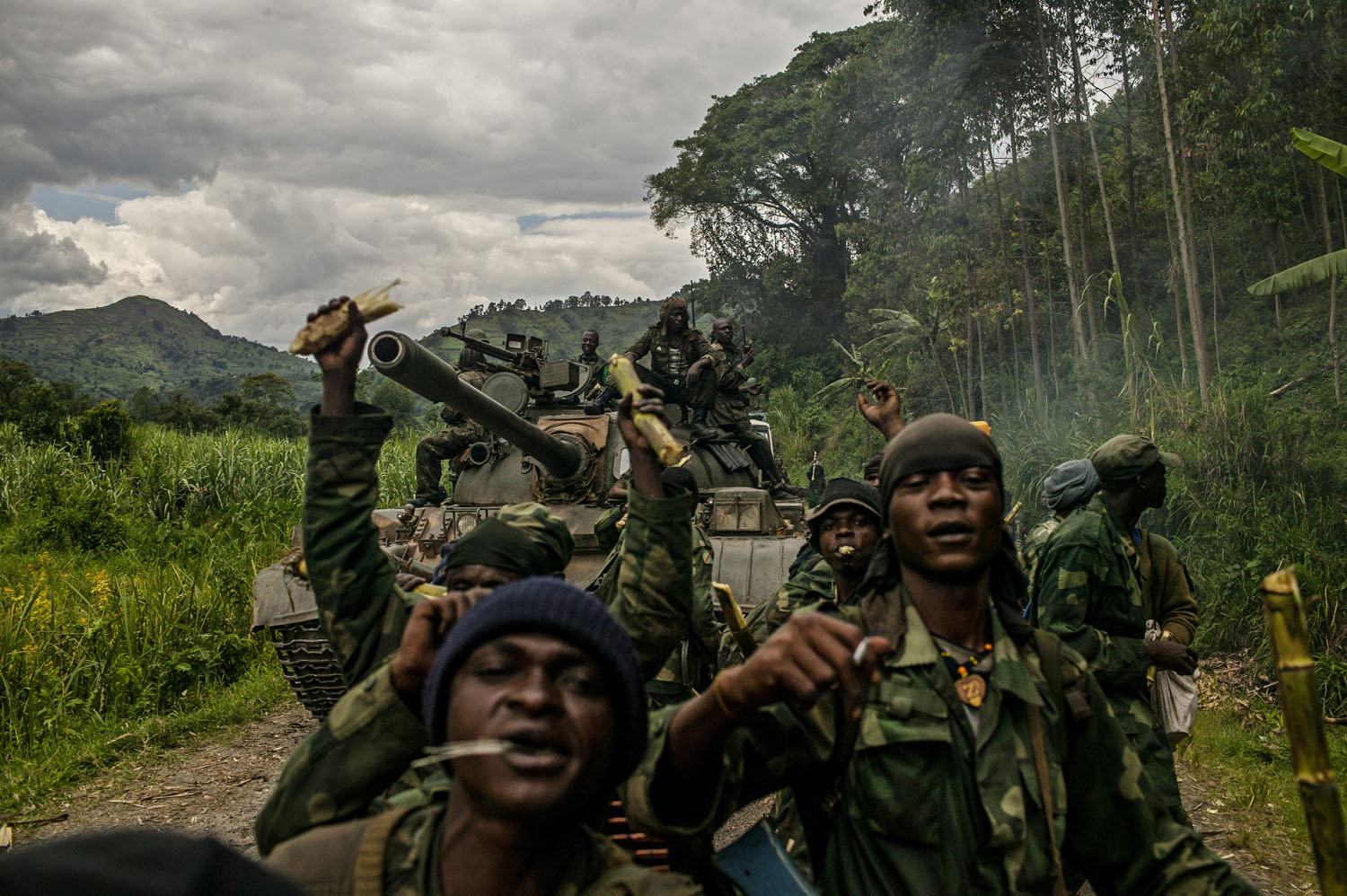  Congolese soldiers celebrate as they advance up the mountainous road toward Bunagana, the last remaining stronghold of the M-23 rebels on Wednesday. 