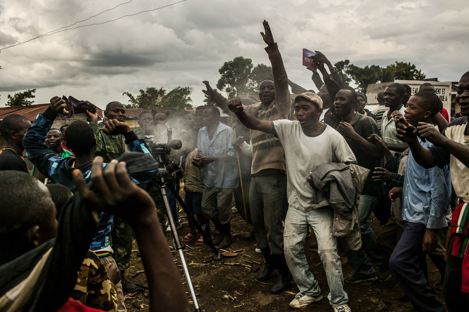  With heavy guns still smoking, residents of the town of Bunagana, celebrate the routing of M-23 rebels by the Congolese army.  