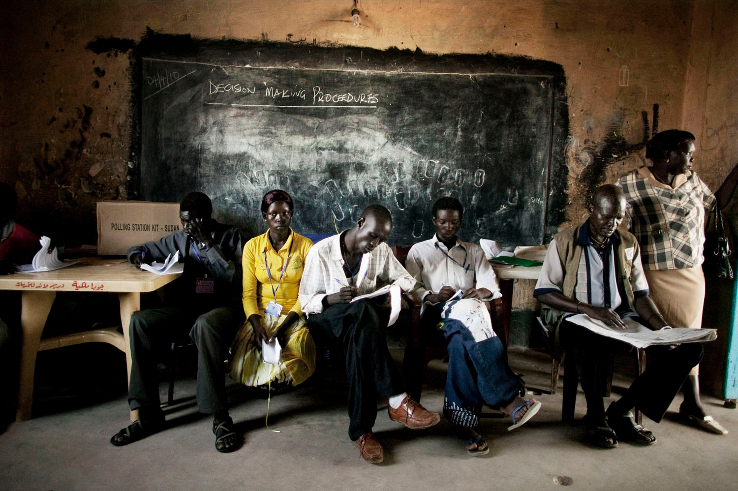  Southern Sudanese election observers and political party agents sit inside a polling station in Juba, southern Sudan during the country's historic presidential, parliamentary and gubernatorial elections in April 2010. The elections were the first to