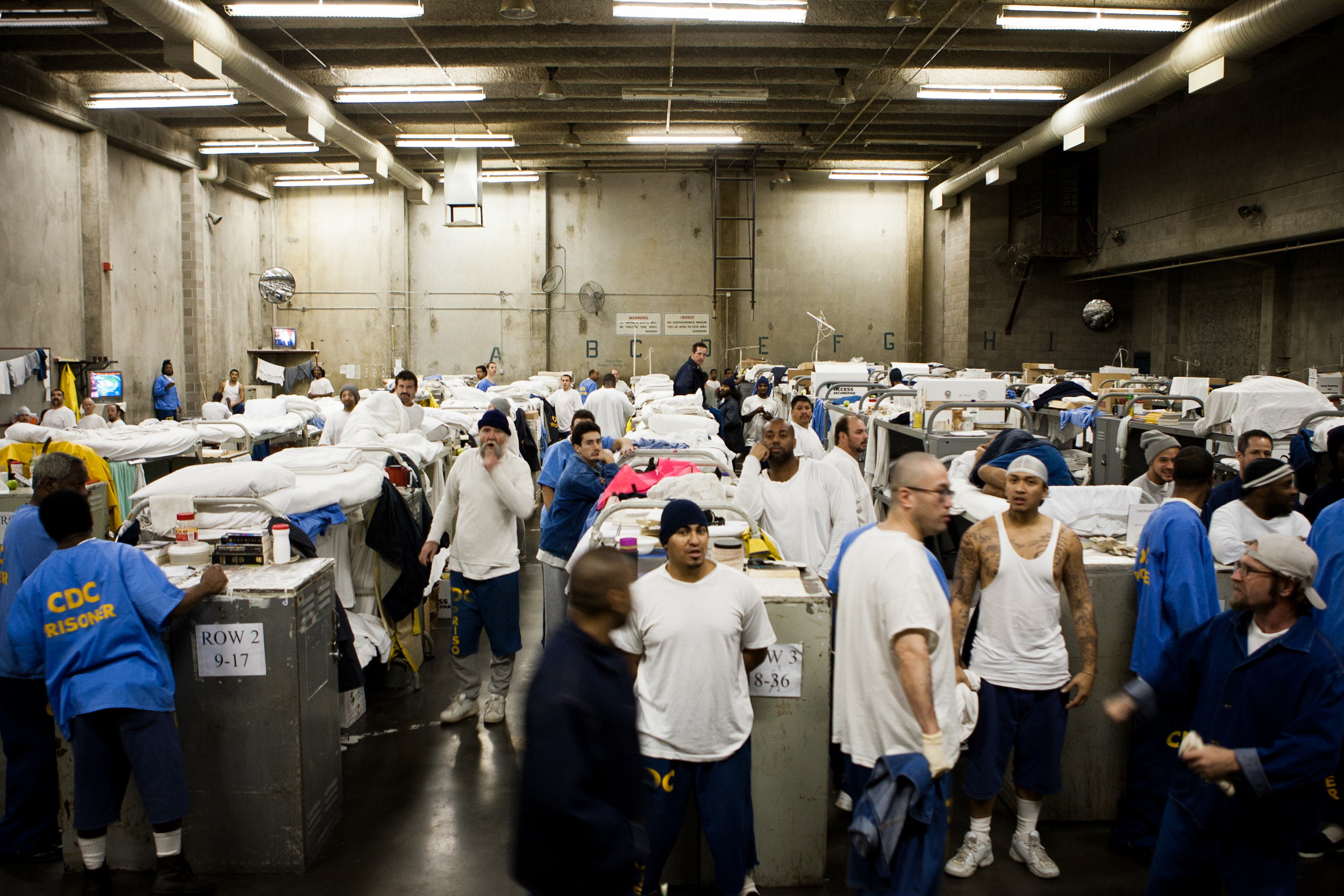  Inmates are crowded into gymnasiums coverted into dormitories at the California State Prison - Sacramento in Folsom, California. The California prison system is so crowded that 16,000 inmates are assigned cots in hallways and gyms 