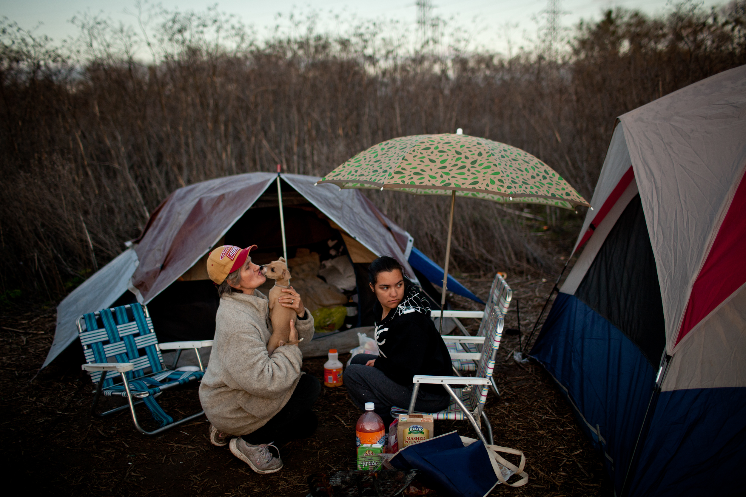  Evelyn Marrs-Benn, left, and Chanae Hanger hang out at the SafeGround homeless tent camp in Sacramento, California. 