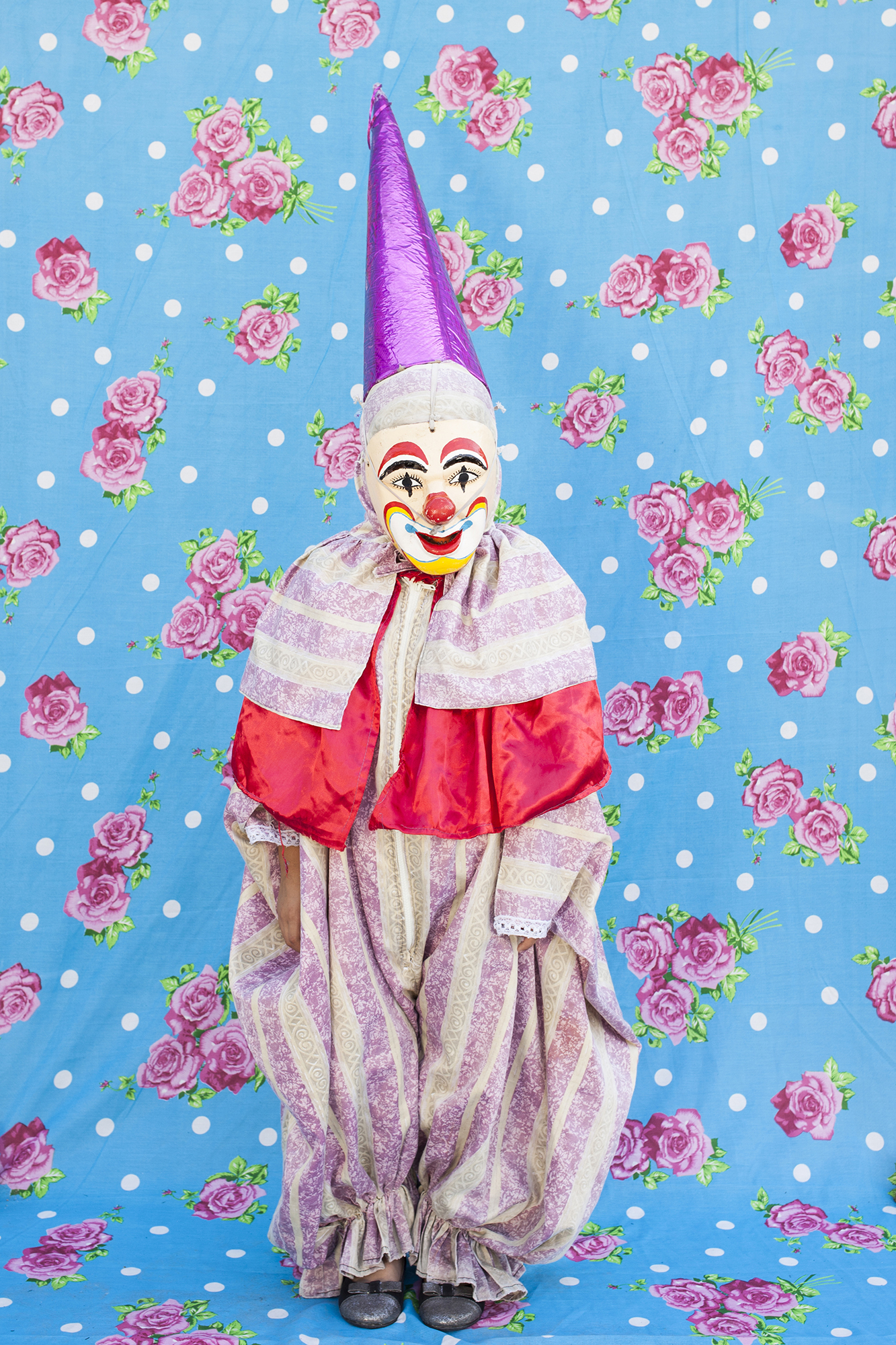  Portrait of dancing clown with the typical costume. When they use their masks they prefer not to reveal their identity. From the gang "Cuadrilla de Juquilita", Coatepec, Veracruz, Mexico, 2016. 