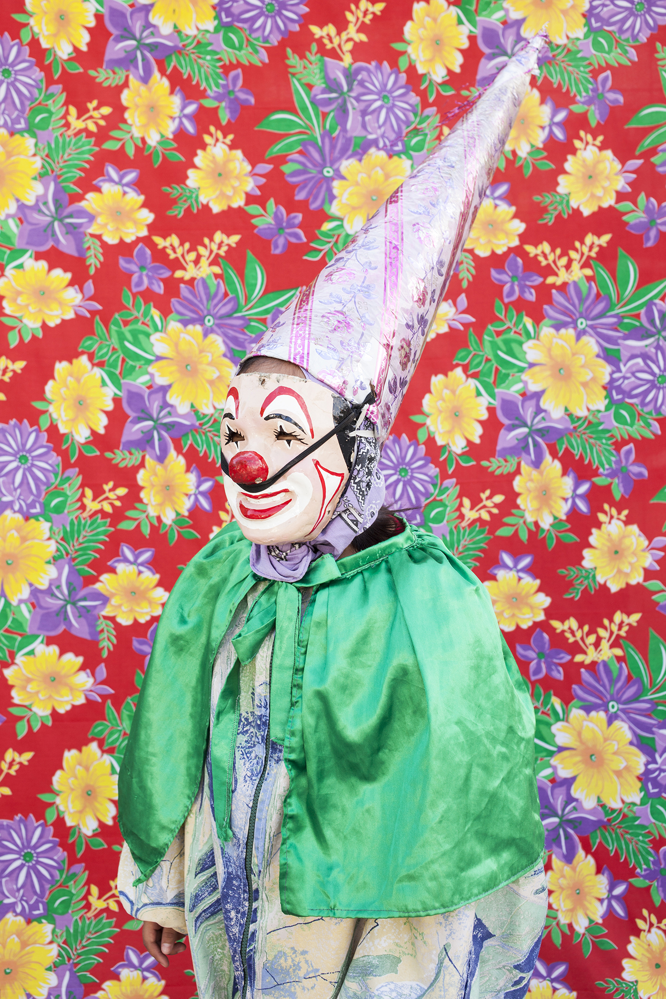  Portrait of dancing clown with the typical costume. When they use their masks they prefer not to reveal their identity. From the gang "Cuadrilla de Juquilita", Coatepec, Veracruz, Mexico, 2016. 