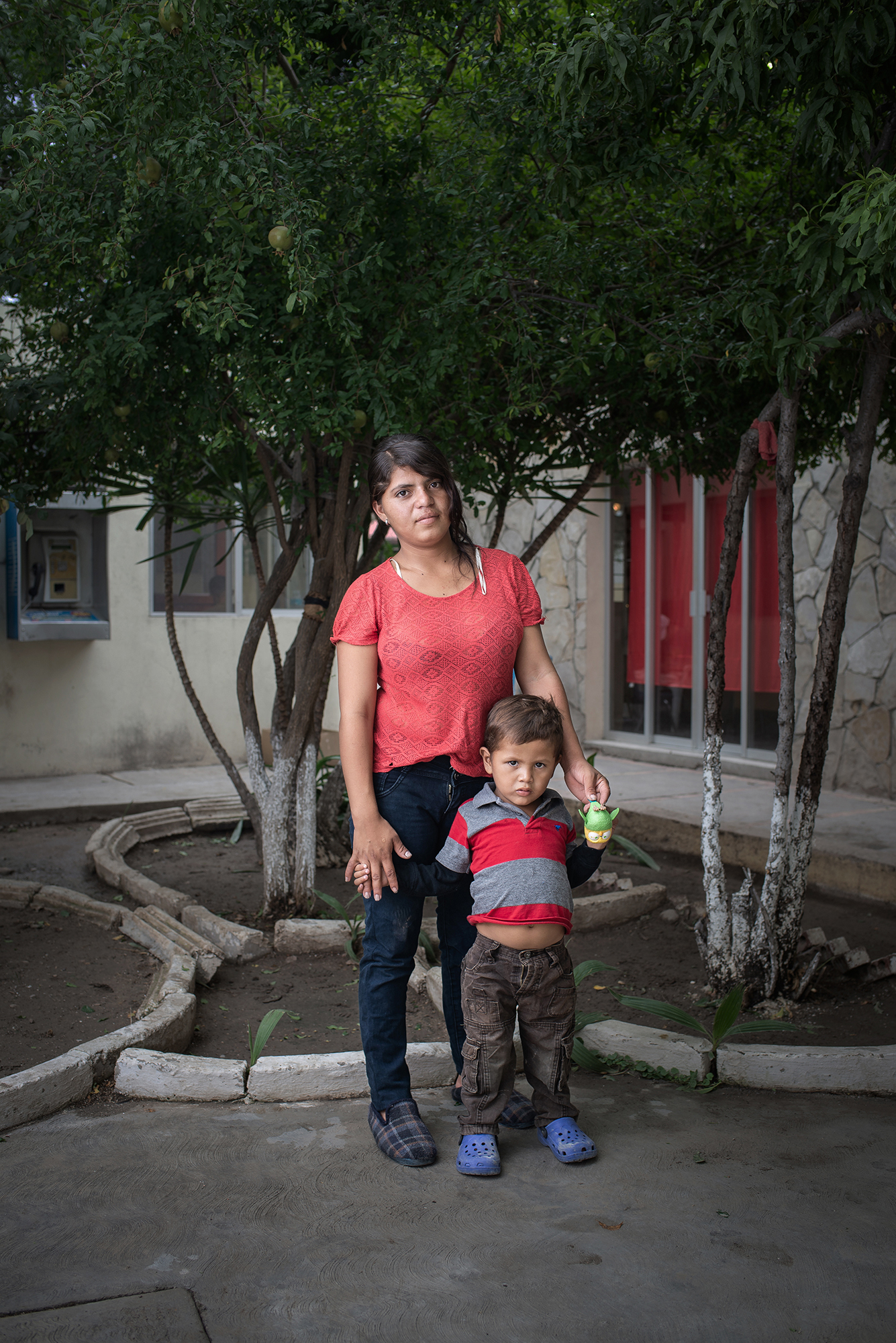  Portrait of Diana Marisol (19 years old) and her son Denis Jose (3 years old) at "Casa del Migrante Frontera Digna" created by priest Jose Guadalupe Valdes Alvarado. Diana left her homecountry Honduras due to the violent situation her country is fac