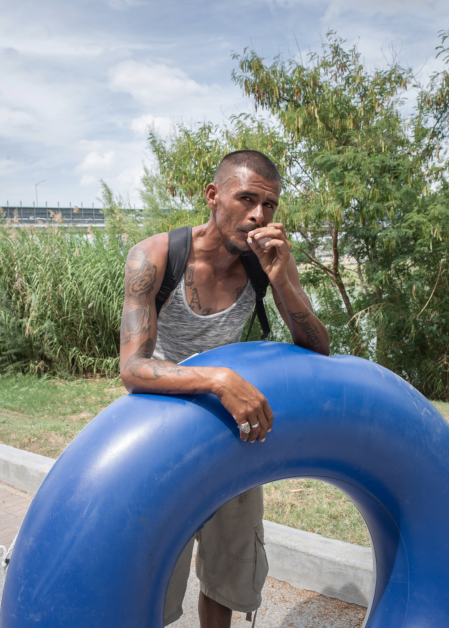  Portrait of Manuel, who affirms to be willing to cross the river with his inner tube. This person is most likely a "Coyote" (someone who charges for helping migrants cross). Rio Grande is known for being a natural border between Mexico and the Unite