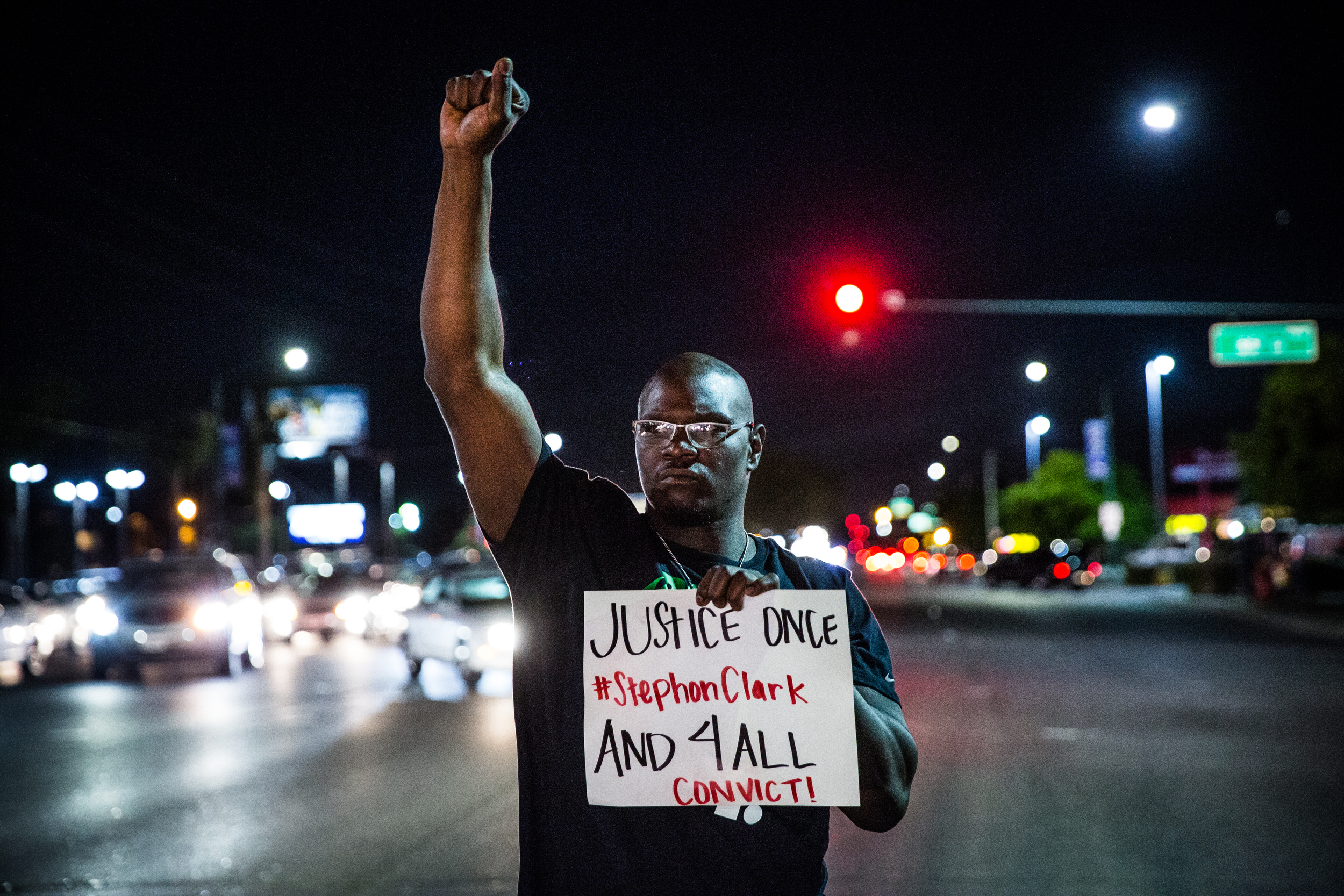 Tyvonne Joseph protests in the street during a candlelight vigil for Stephon Clark in South Sacramento on March 31, 2018. 
