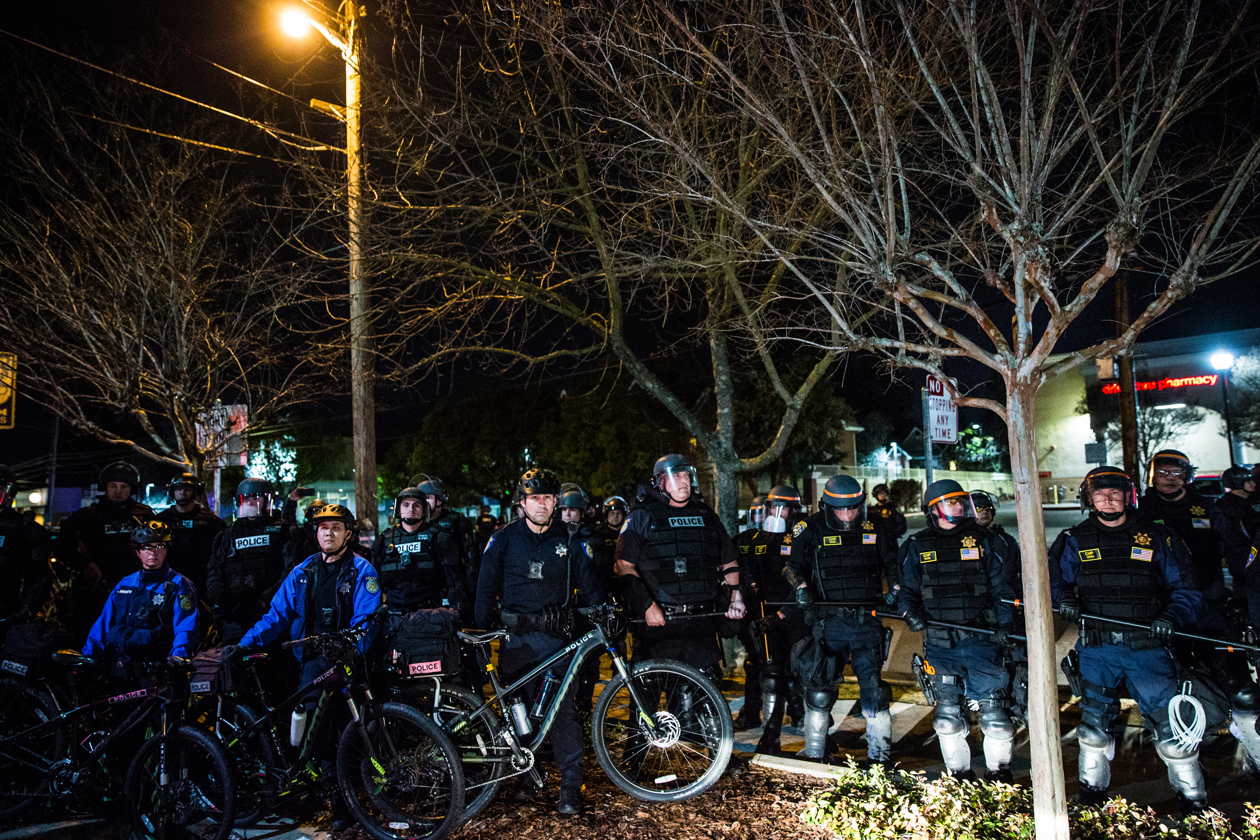  Police advance on peaceful protestors in the wealthy East Sacramento neighborhood known as the "Fab Forties" to protest the Sacramento County District Attorney's decision to not charge the officers who shot an unarmed Clark in 2018. Sacramento Polic