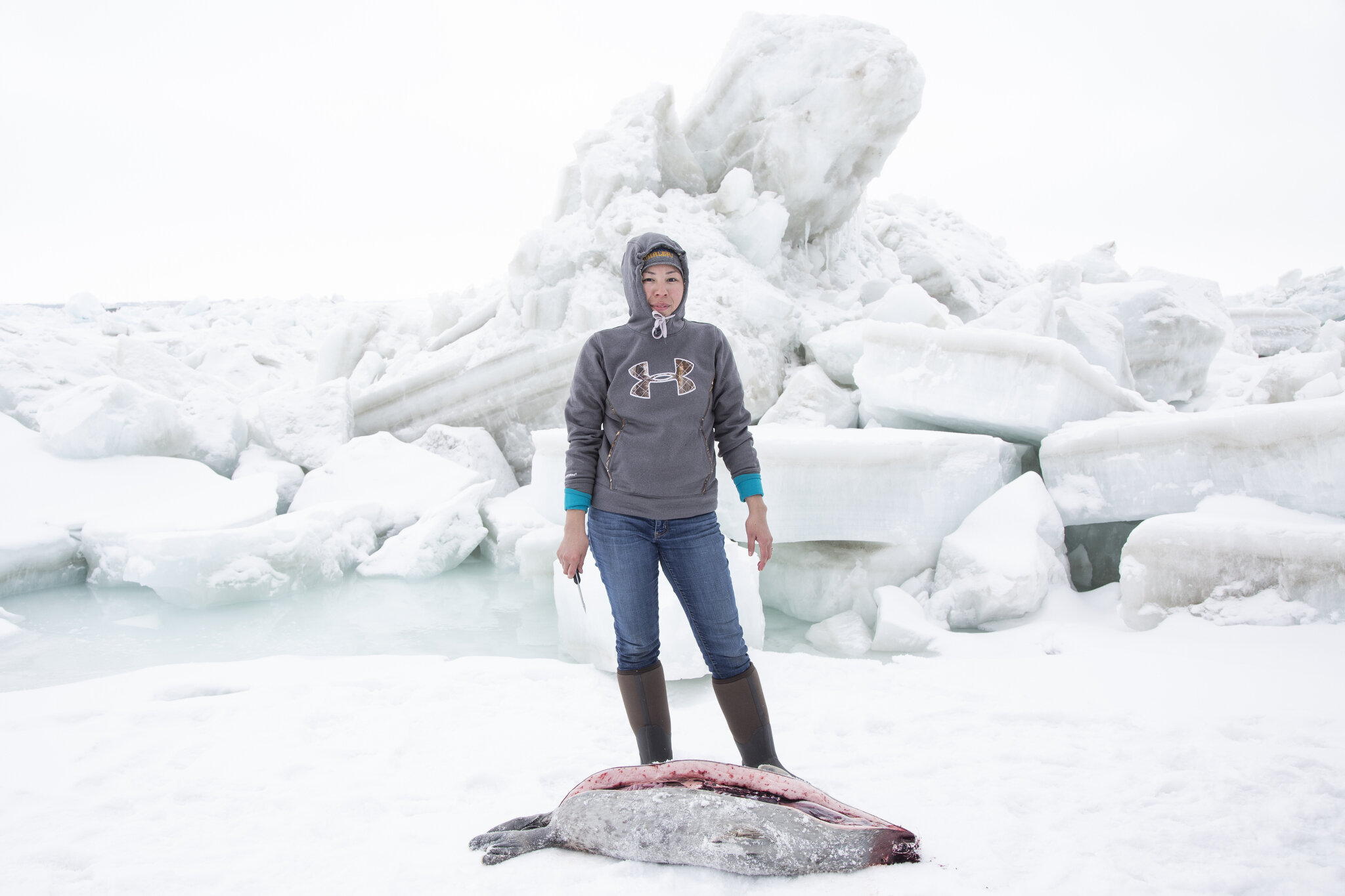  Flora Aiken processes a seal near Utqiaġvik (formerly known as Barrow), Alaska. April 27th, 2016. Hunting is an important rite of passage for the Inupiat families of the Alaskan Arctic, especially as these traditions are at an even greater risk of d