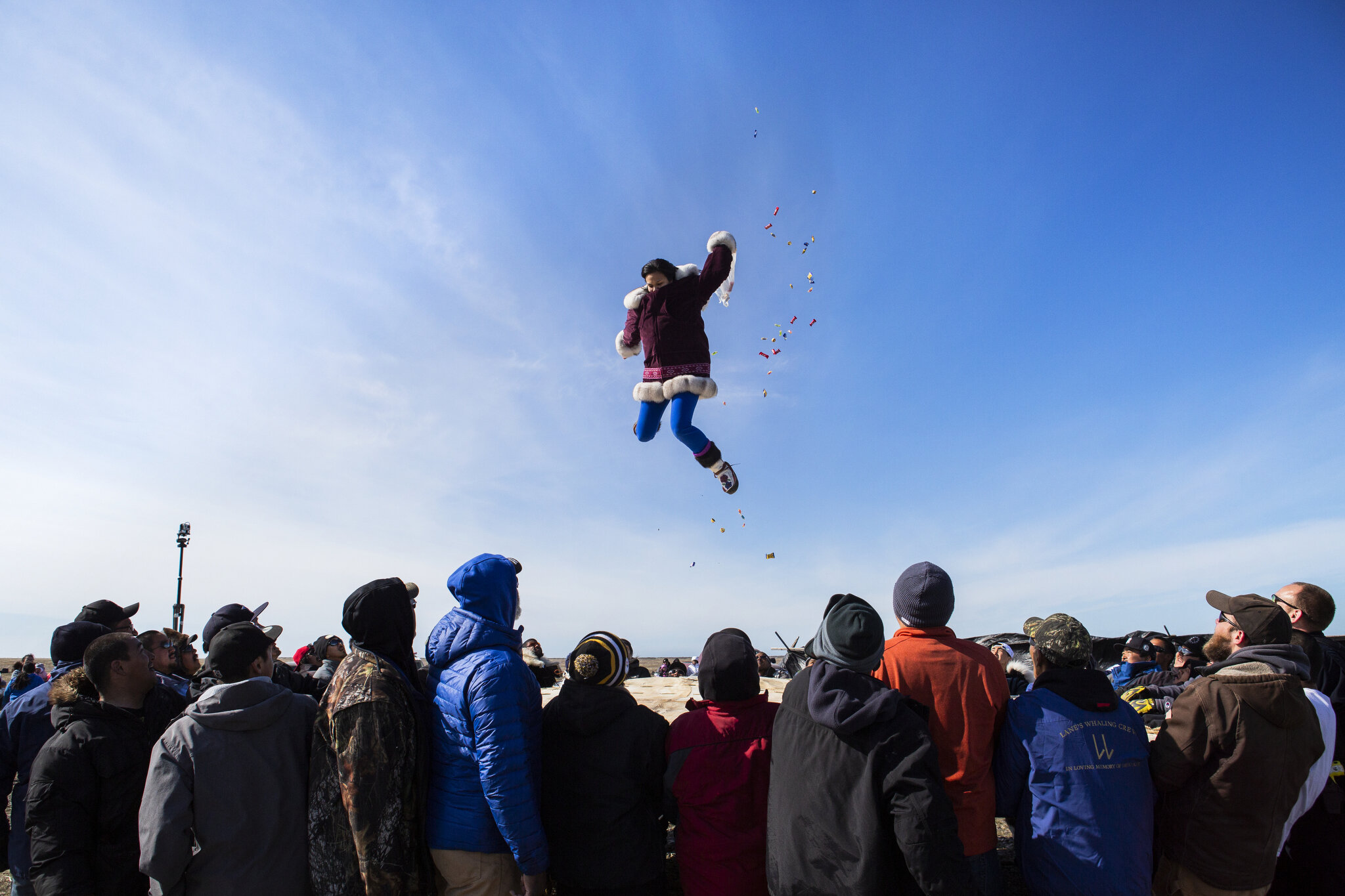  The Nalukataq, or blanket toss, in Point Hope, Alaska. The blanket toss is a celebratory Iñupiat tradition, originating from long ago when hunters would get launched into the air on what was (and still is) a giant trampoline made out of seal skins i