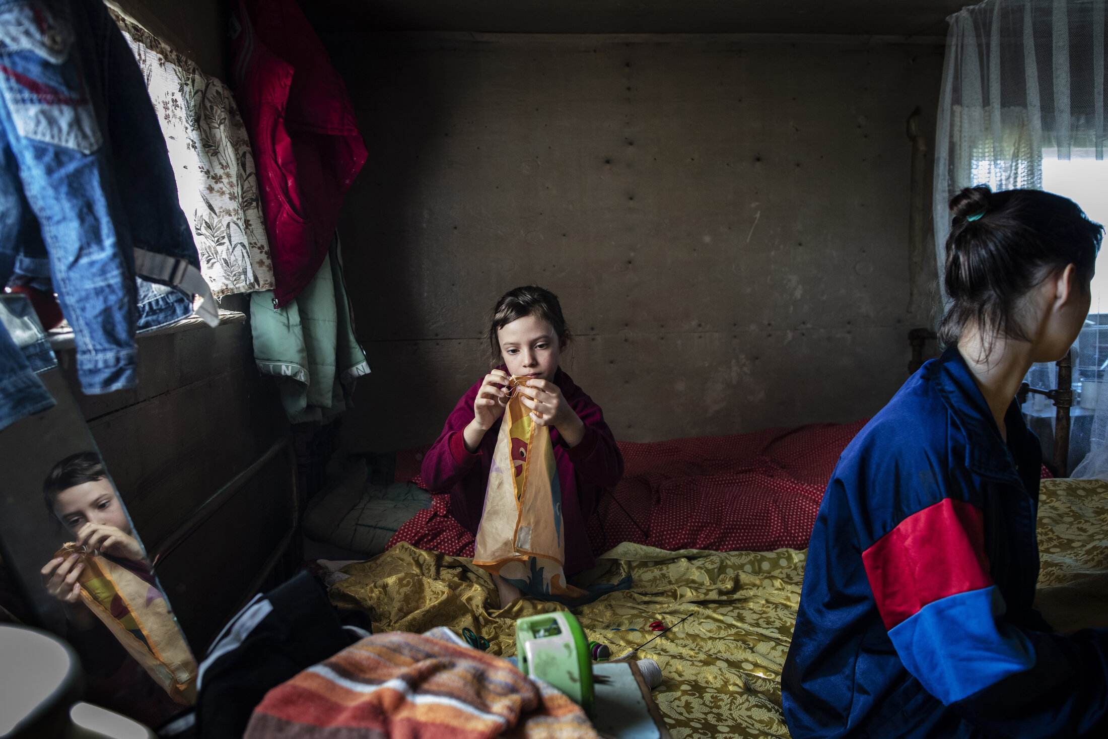  Edic's daughters at their cabin outside of Chersky, Siberia. Families in this region depend on fishing and hunting as dietary staples, and struggle to keep their fish and meat fresh with their ice cellars, or freezers, that are dug into the permafro