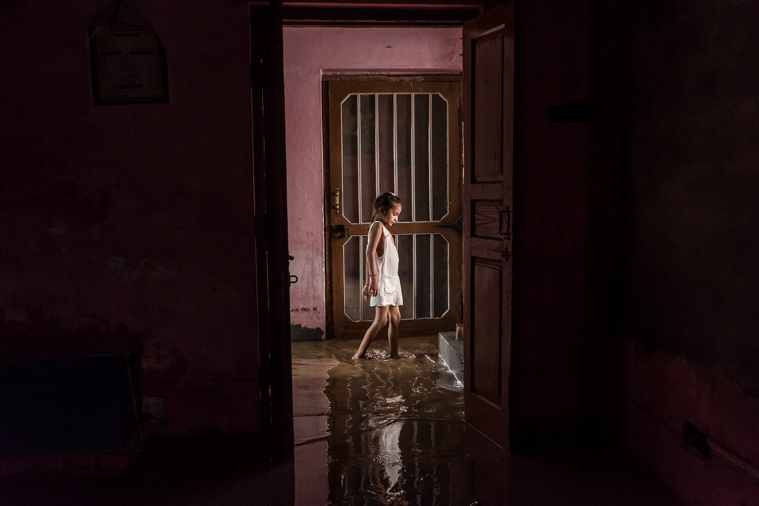  The floor of a house is covered with standing water after the canal slicing through town flooded at around 7am that morning on Tuesday, August 8, 2017 in Nai Basti, India. Many of the 150 houses in the village were damaged by the flooding. 