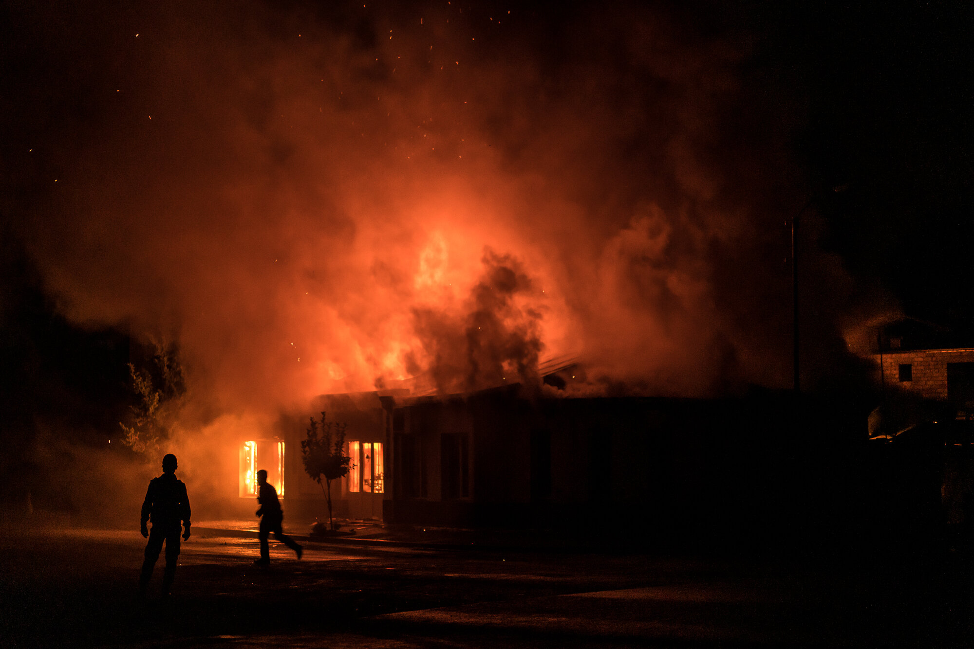  A fire burns in a hardware store after a rocket attack caused the building to catch fire. Stepanakert, Nagorno-Karabakh. 2020. 