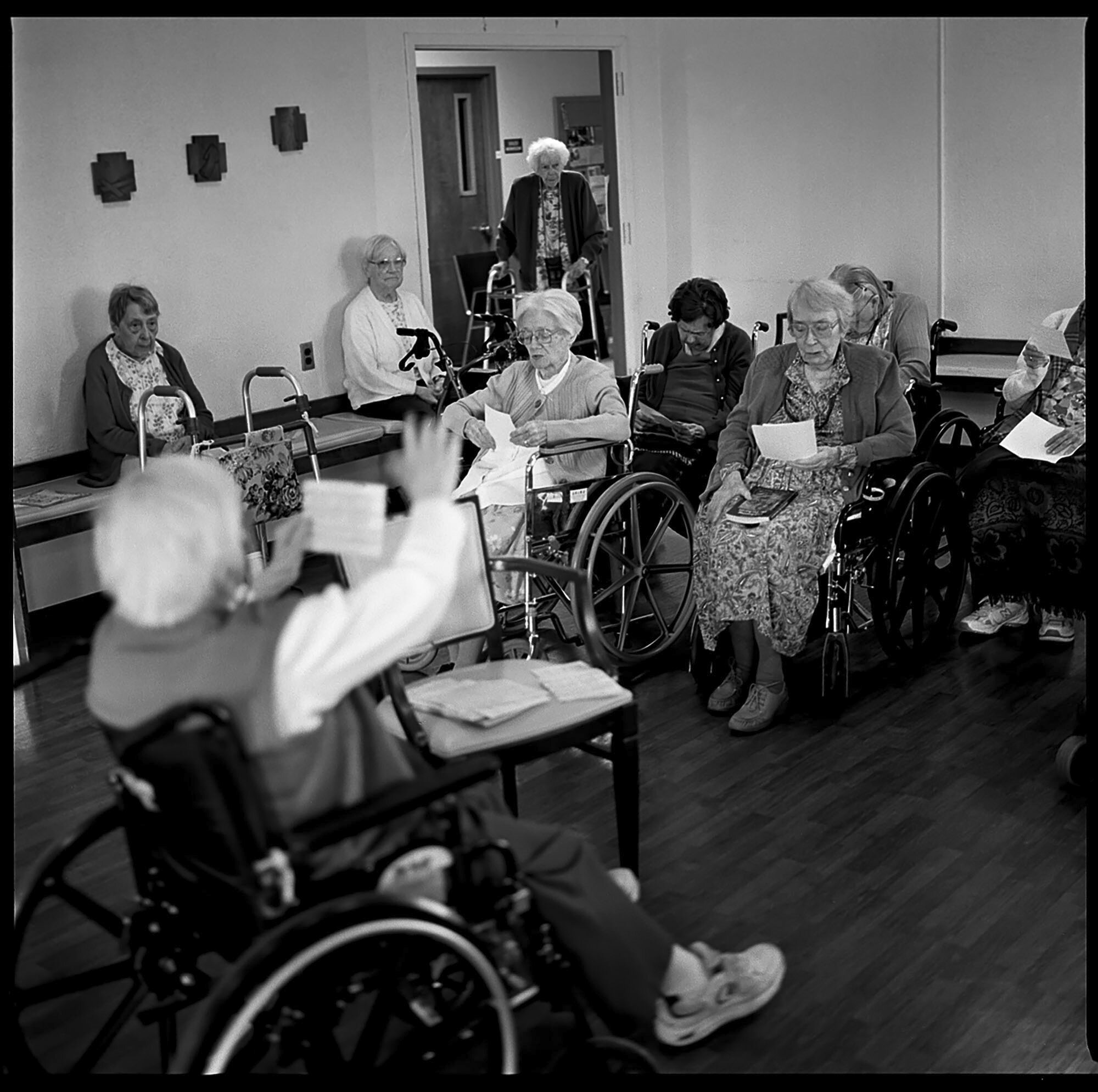  Monthly choir practice is held as some Sisters quietly sleep through the session.  