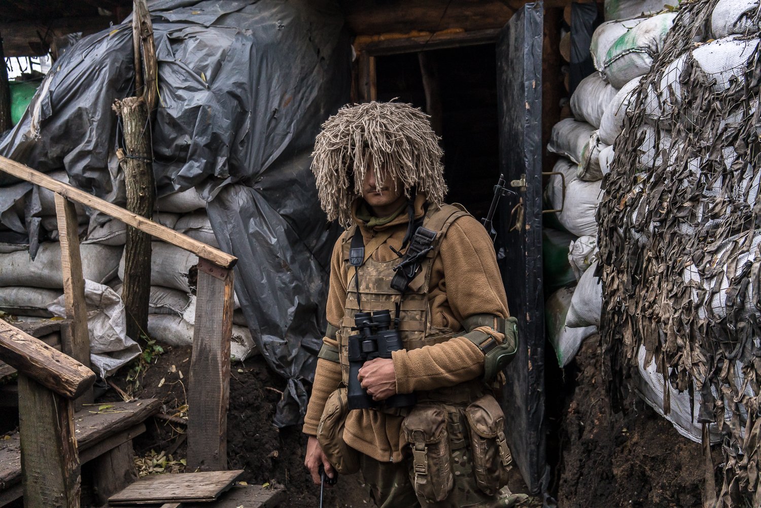  Dima, a soldier at a front line position called Warrior, poses for a portrait on Thursday, November 4, 2021 in Hranitne, Ukraine. 