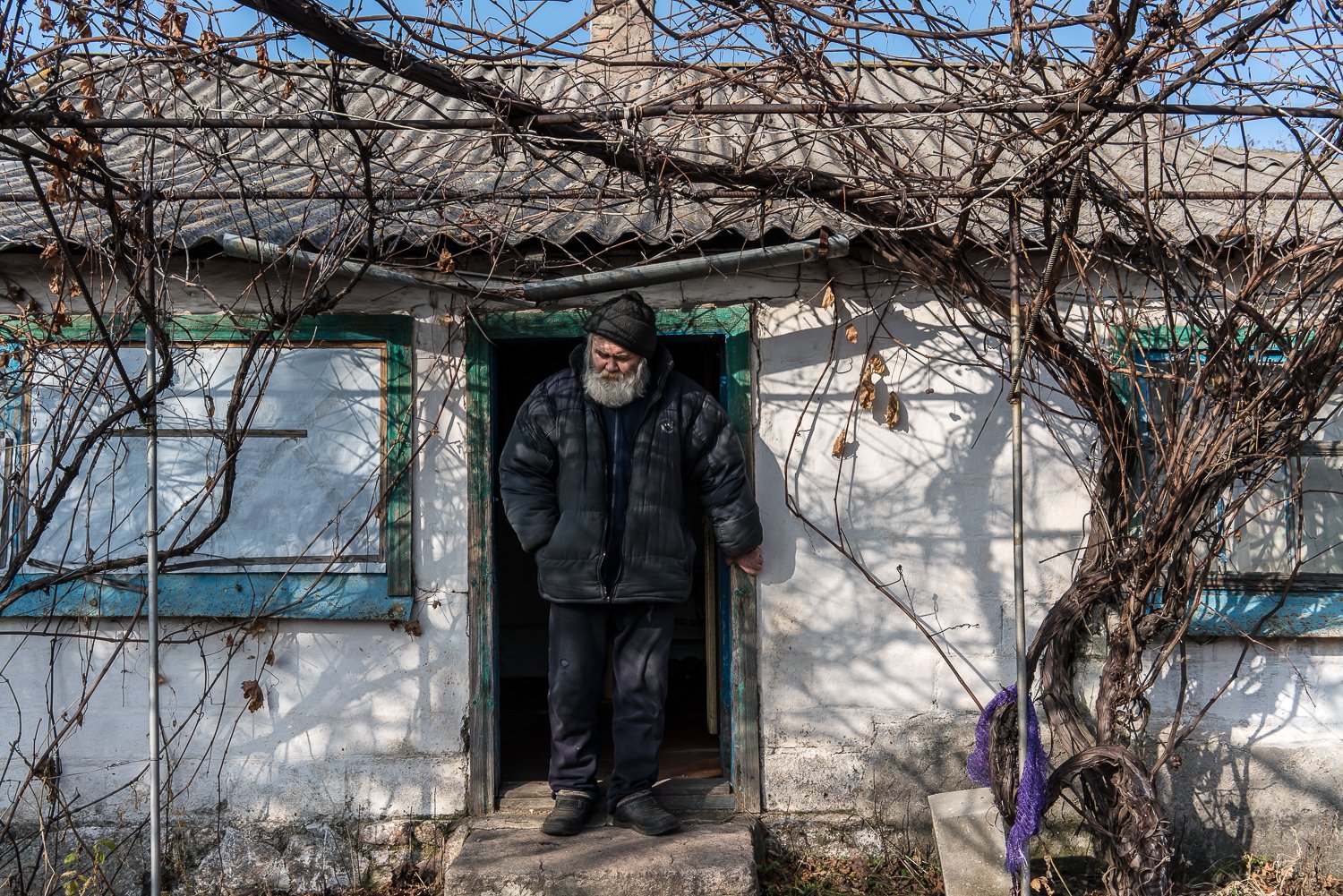  Khalid Yakubov, 63, who is blind and suffers from diabetes, in the doorway of his home after a visit from charity workers on Friday, November 5, 2021 in Hranitne, Ukraine. The town is located on the front line of Ukraine's war with Russian-backed se
