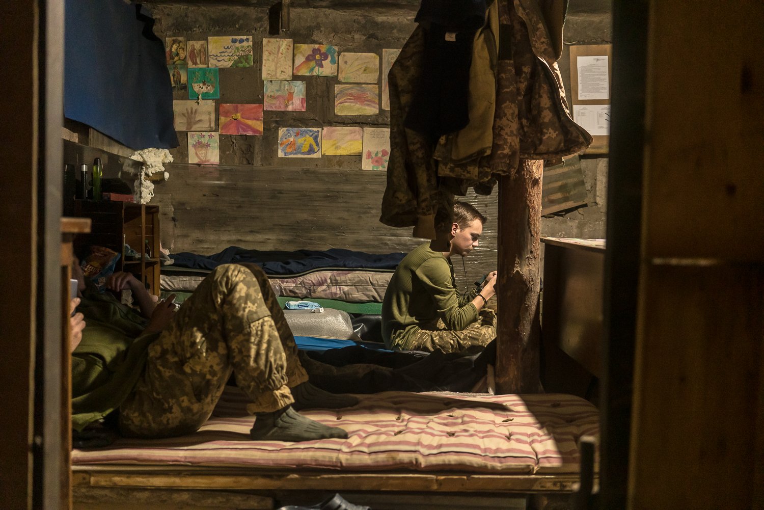  A soldier named Vanya and other members of the Ukrainian army's 25th airborne brigade relax in their barracks in the industrial zone on Wednesday, December 1, 2021 in Avdiivka, Ukraine. 