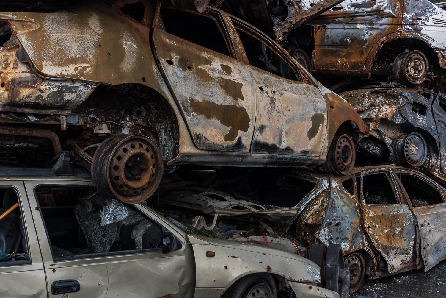 Cars destroyed during fighting between the Ukrianian and Russian militaries are heaped in a parking lot after being cleared from main roads on Thursday, April 21, 2022 in Irpin, Ukraine. 