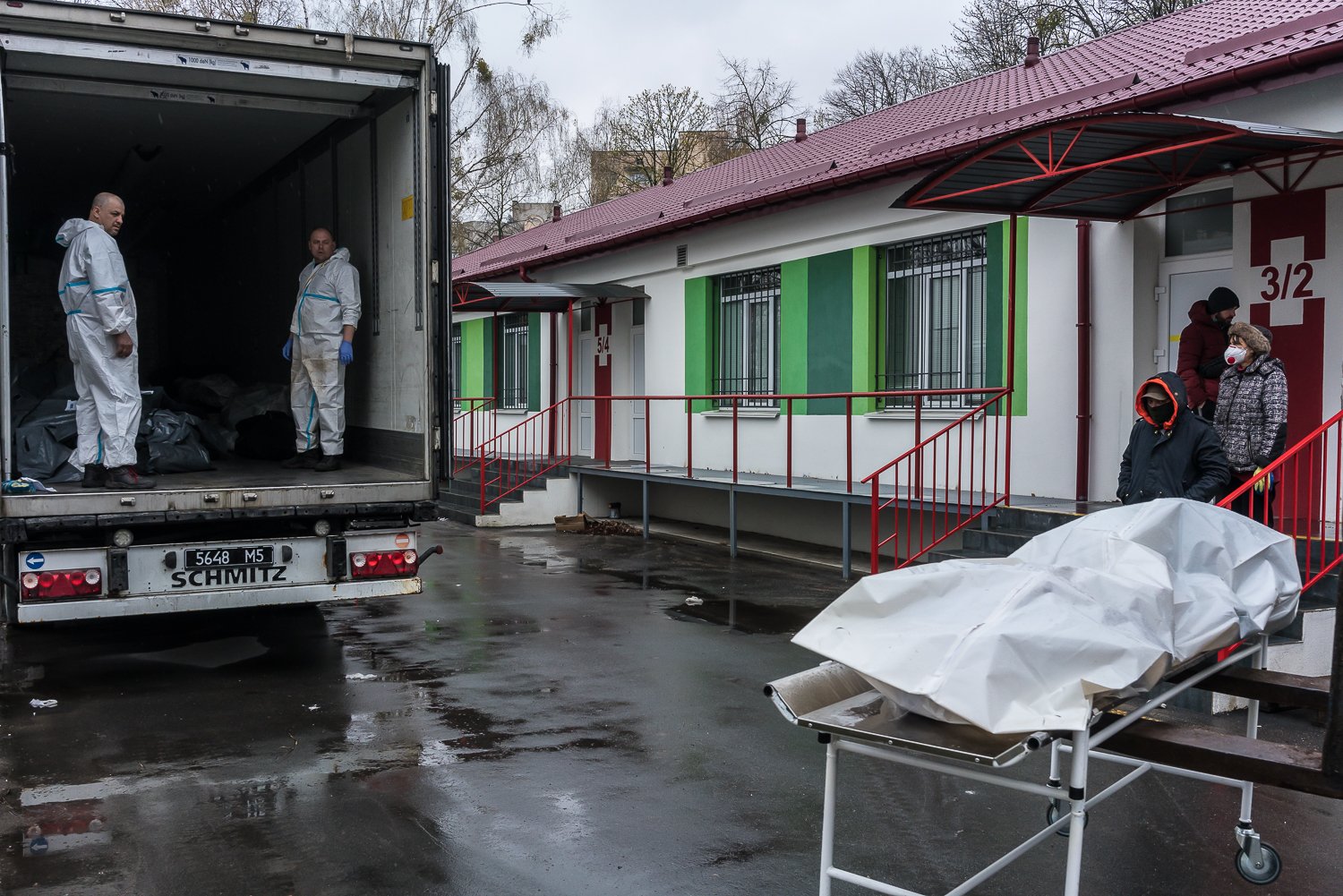  The bodies of civilians who died during the Russian occupation of the city are loaded into a trailer for storage until they can be identified and claimed by family members outside the morgue on Friday, April 22, 2022 in Bucha, Ukraine. 