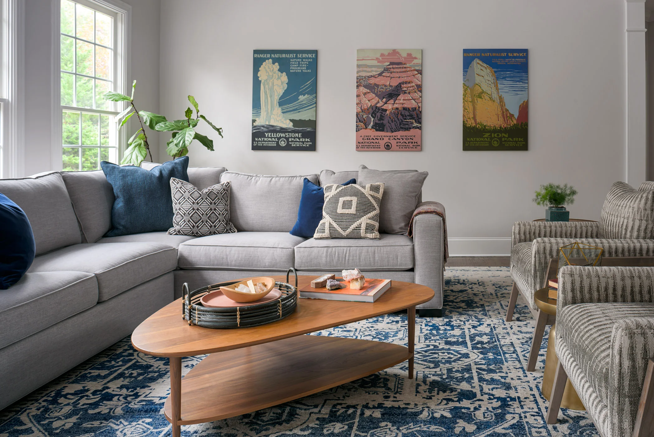 Light gray walls maximize the abundant natural light in every space of the house. We livened up a neutral palette with pops of bright blue, earth tones, and some playful patterned textiles.
