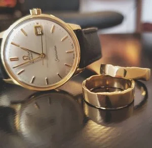 omega+seamater+with+18ct+gold+molten+wedding+rings#.jpg