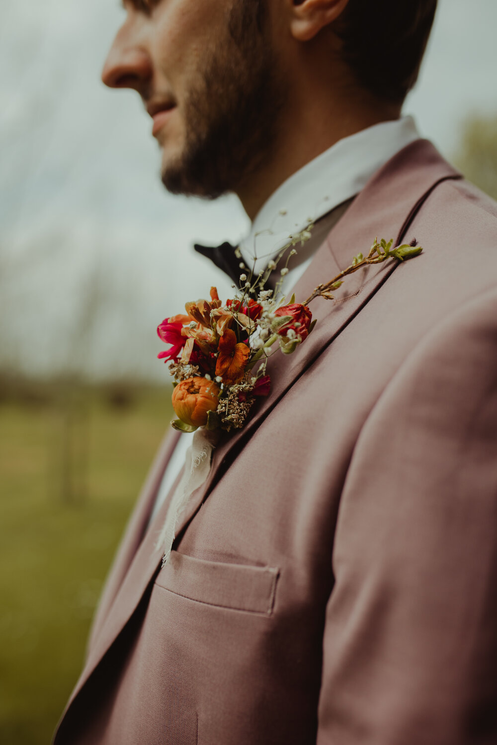 groom buttonhole in rustic tones