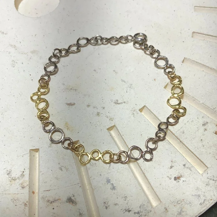 white and yellow gold bubble bracelet