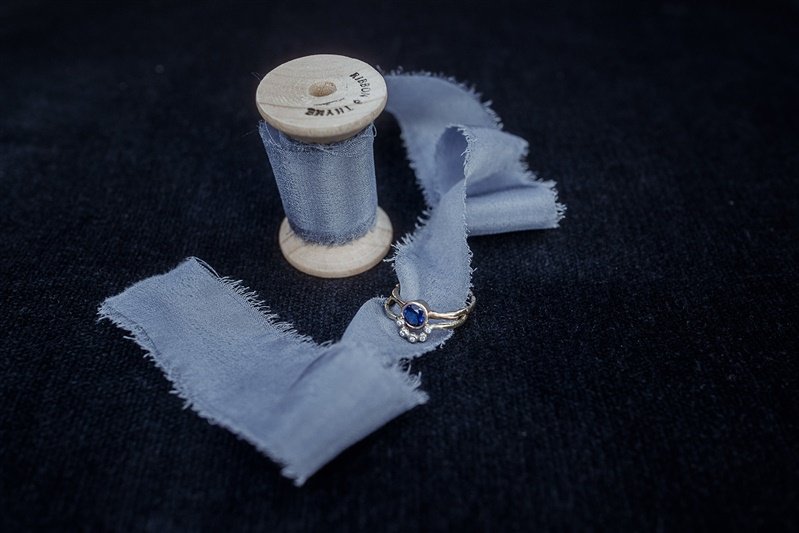Blue sill ribbon for flowers with sapphire engagement ring by Erin Cox Jewellery