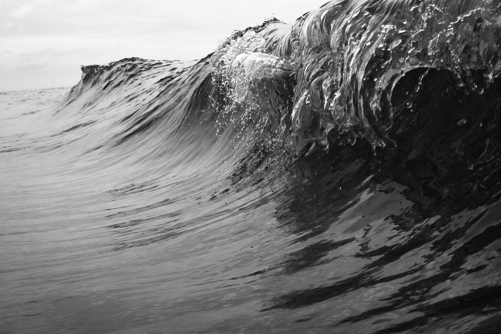 Taken moments before the waves crashed in upon themselves, this black and white photograph shows just how powerful the ocean can be.