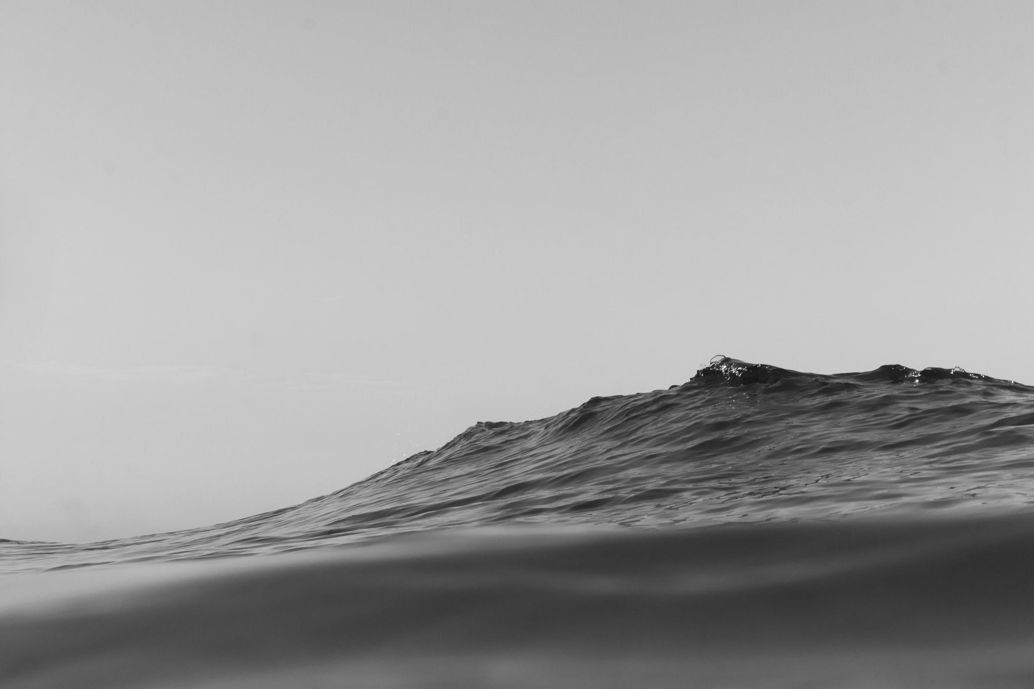 A black and white photograph of the ocean
