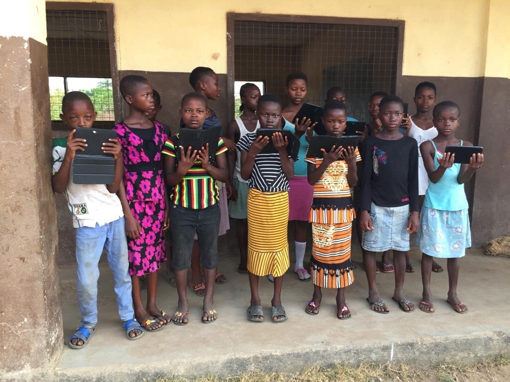 Children learning through tablets at the Gerihun Community Resource Center.