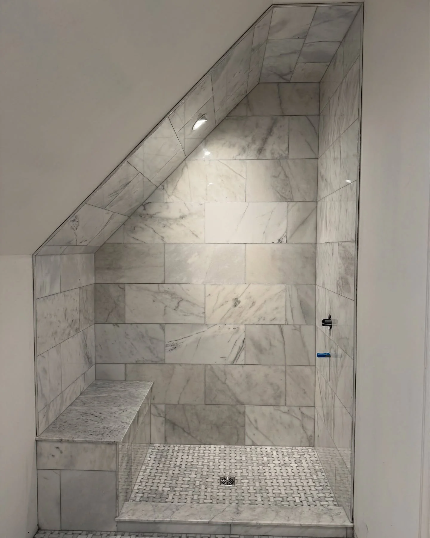 shower-sloped-ceiling-marble-bench-1.jpg