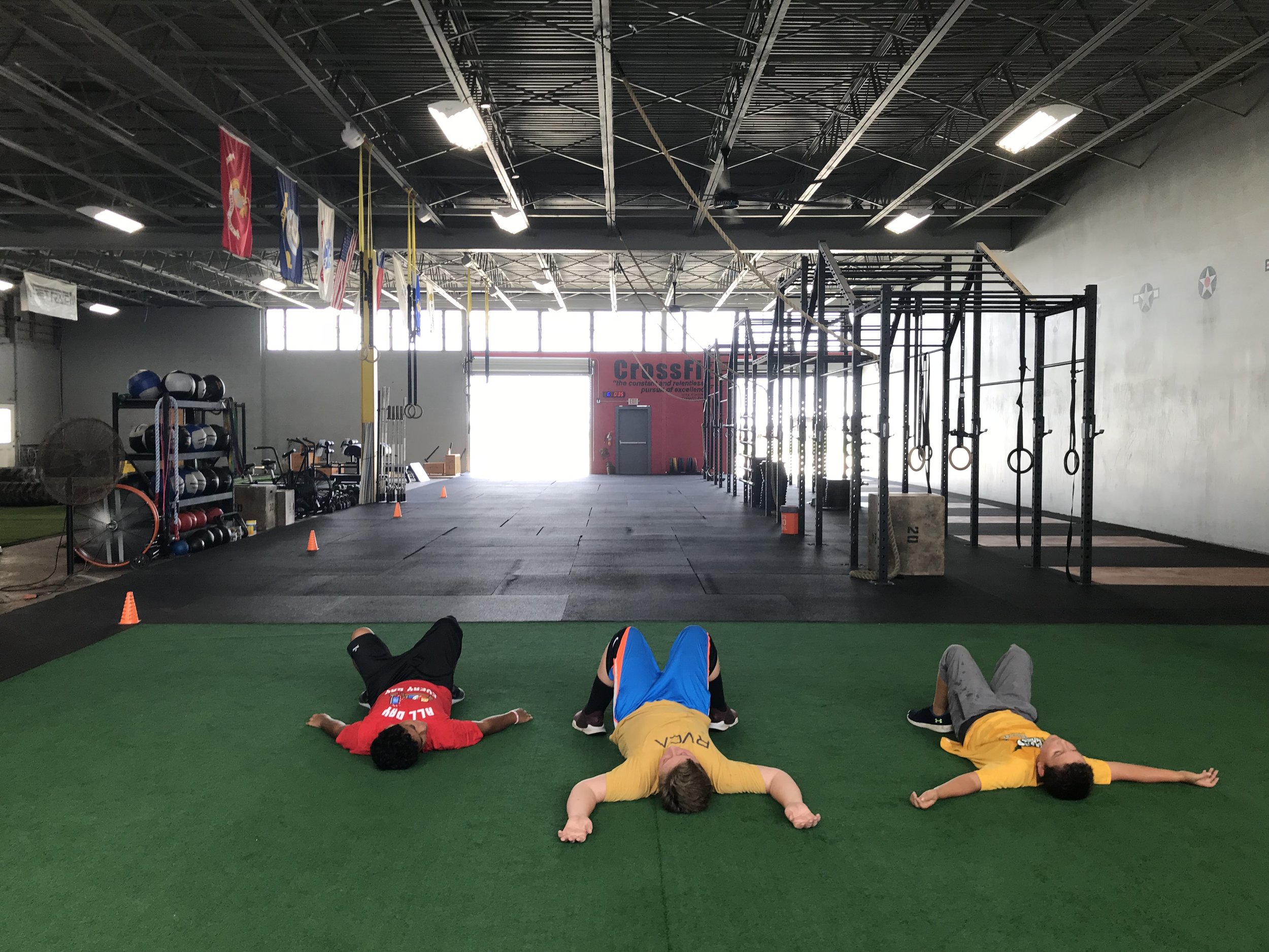 CrossFit Kids relaxing after a good workout!